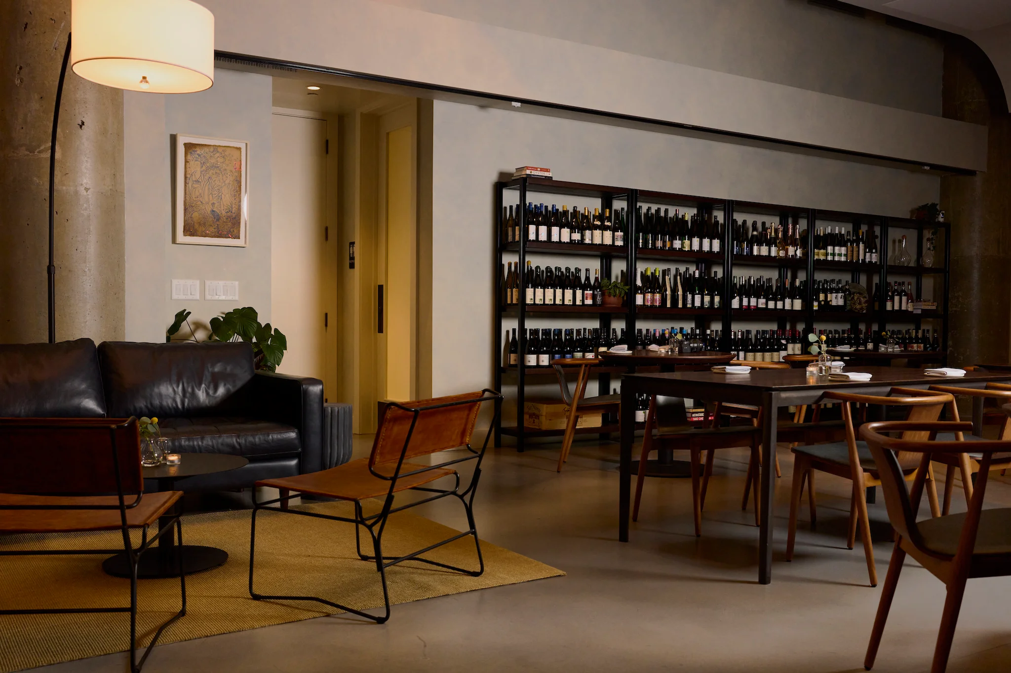 Stylish restaurant interior with wine shelves and cozy seating