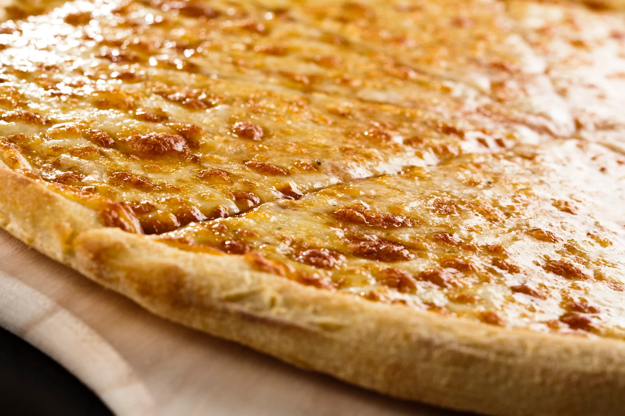 Cheesy Margherita pizza with golden crust