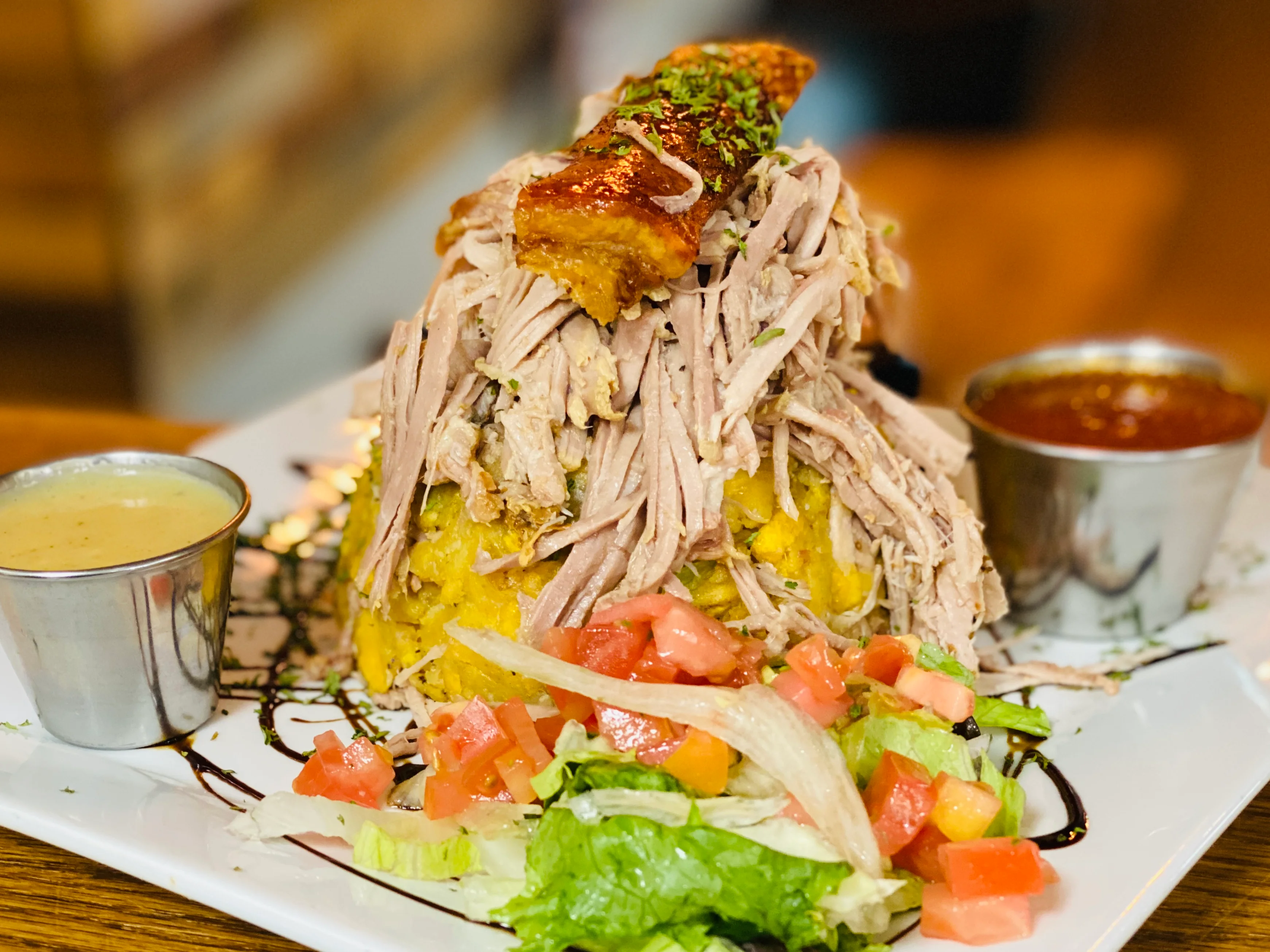 Hearty Cuban ropa vieja served with plantains and salad