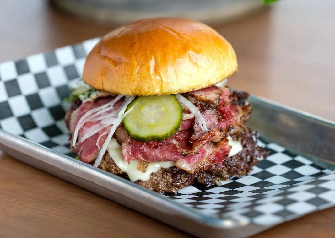 Juicy pastrami burger on a brioche bun