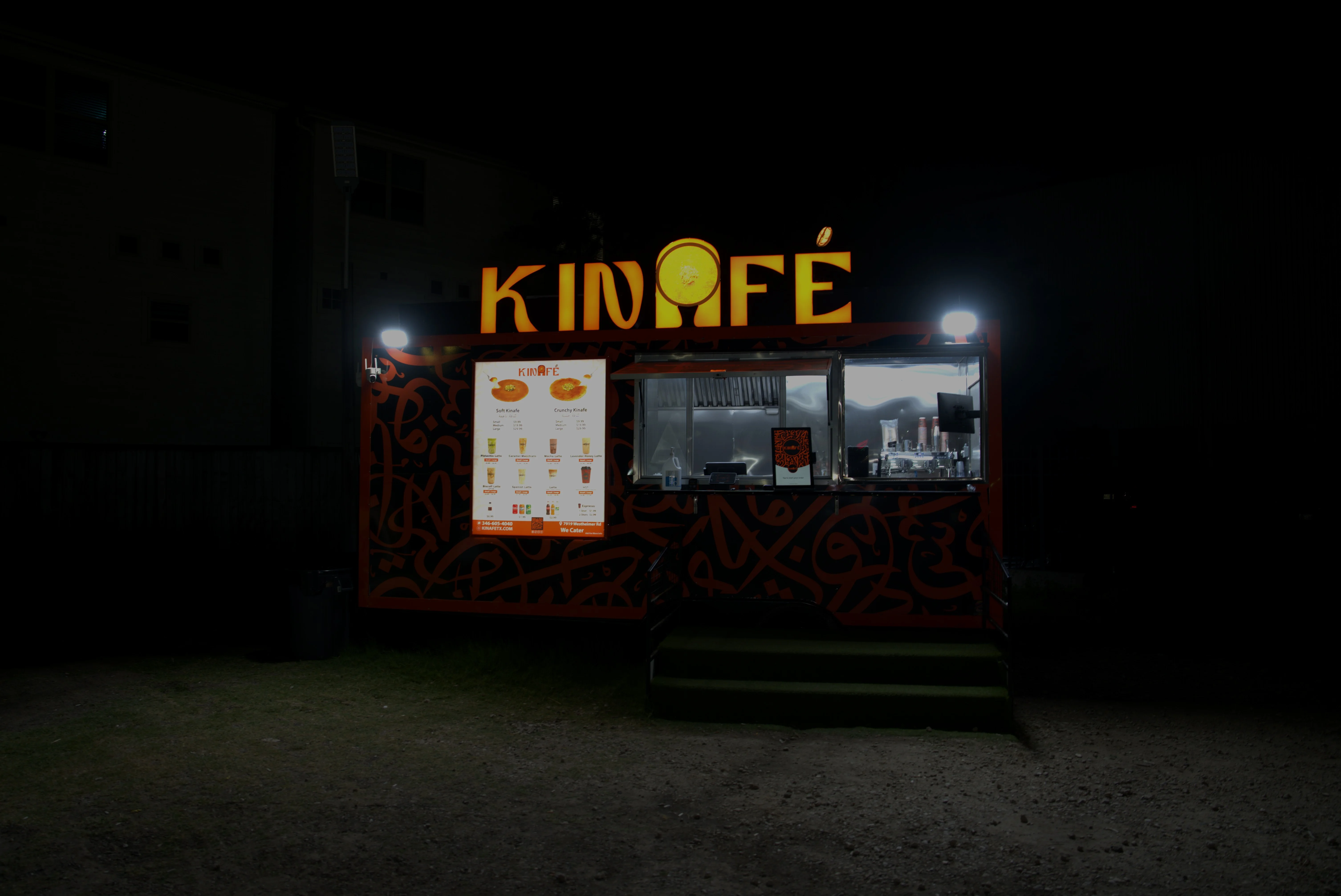 An array of desserts including various cakes and ice cream, beautifully presented on plates.