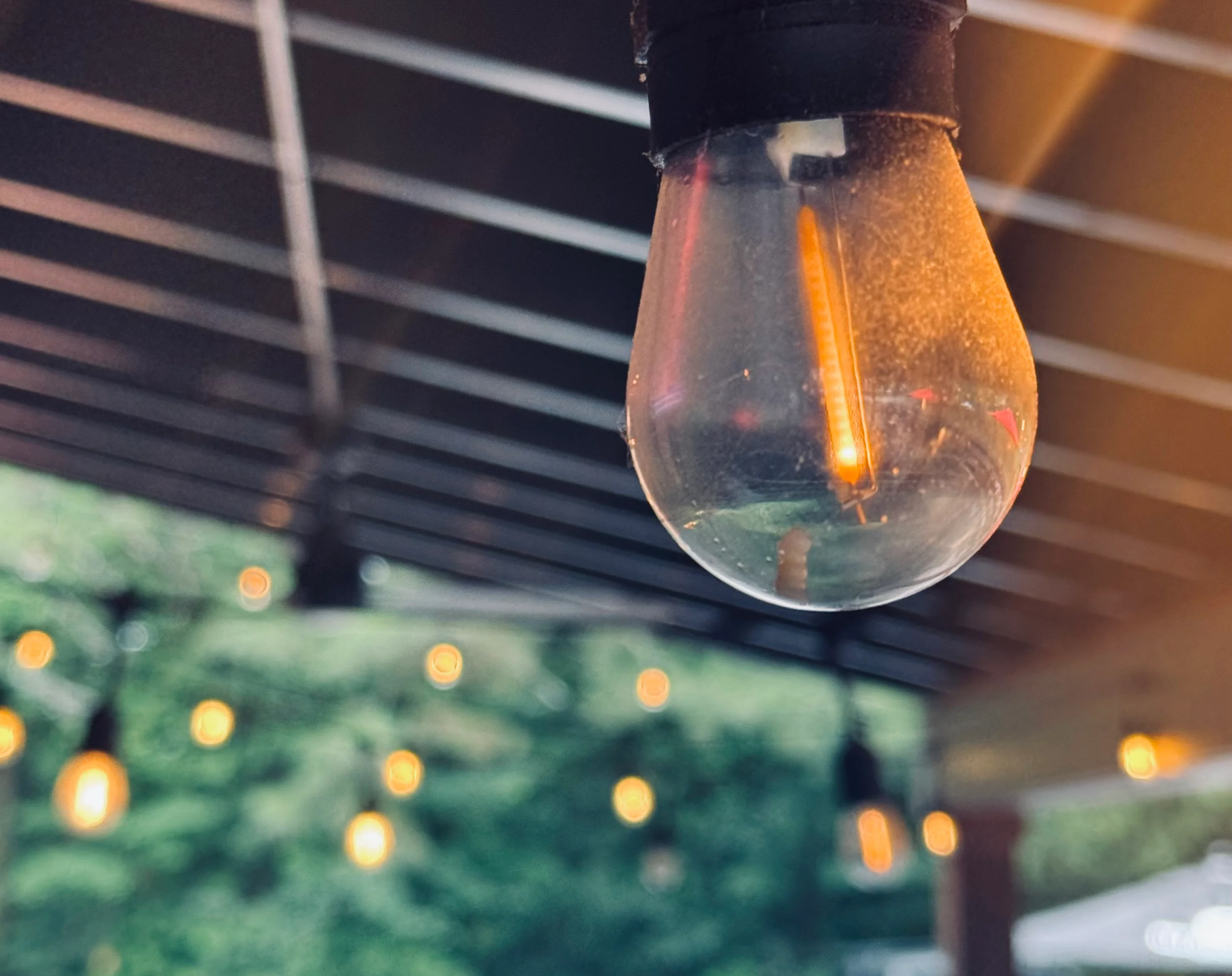 Warm outdoor lighting in a cozy restaurant setting