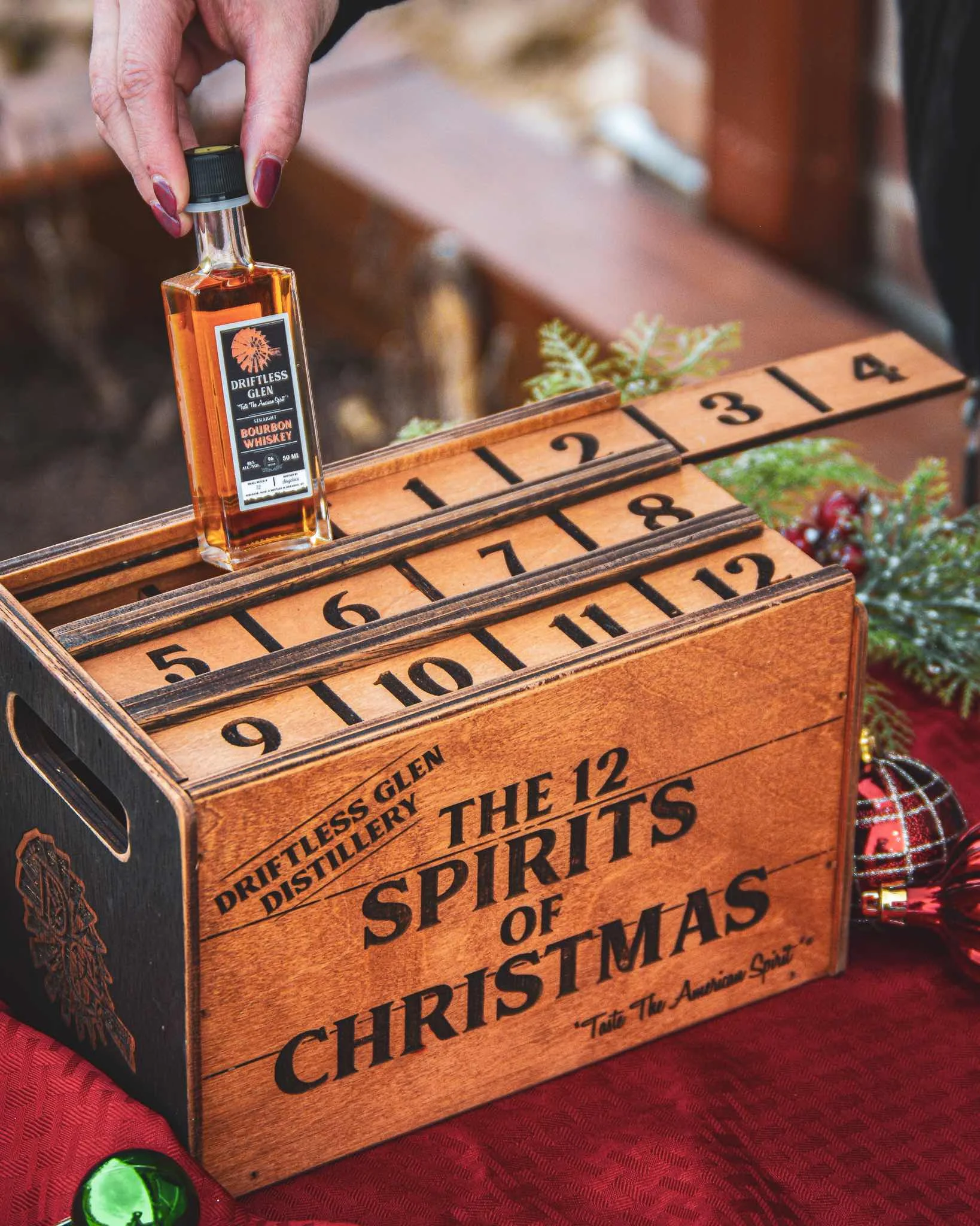 The 12 Spirits of Christmas Advent Calendar with holiday decorations around
