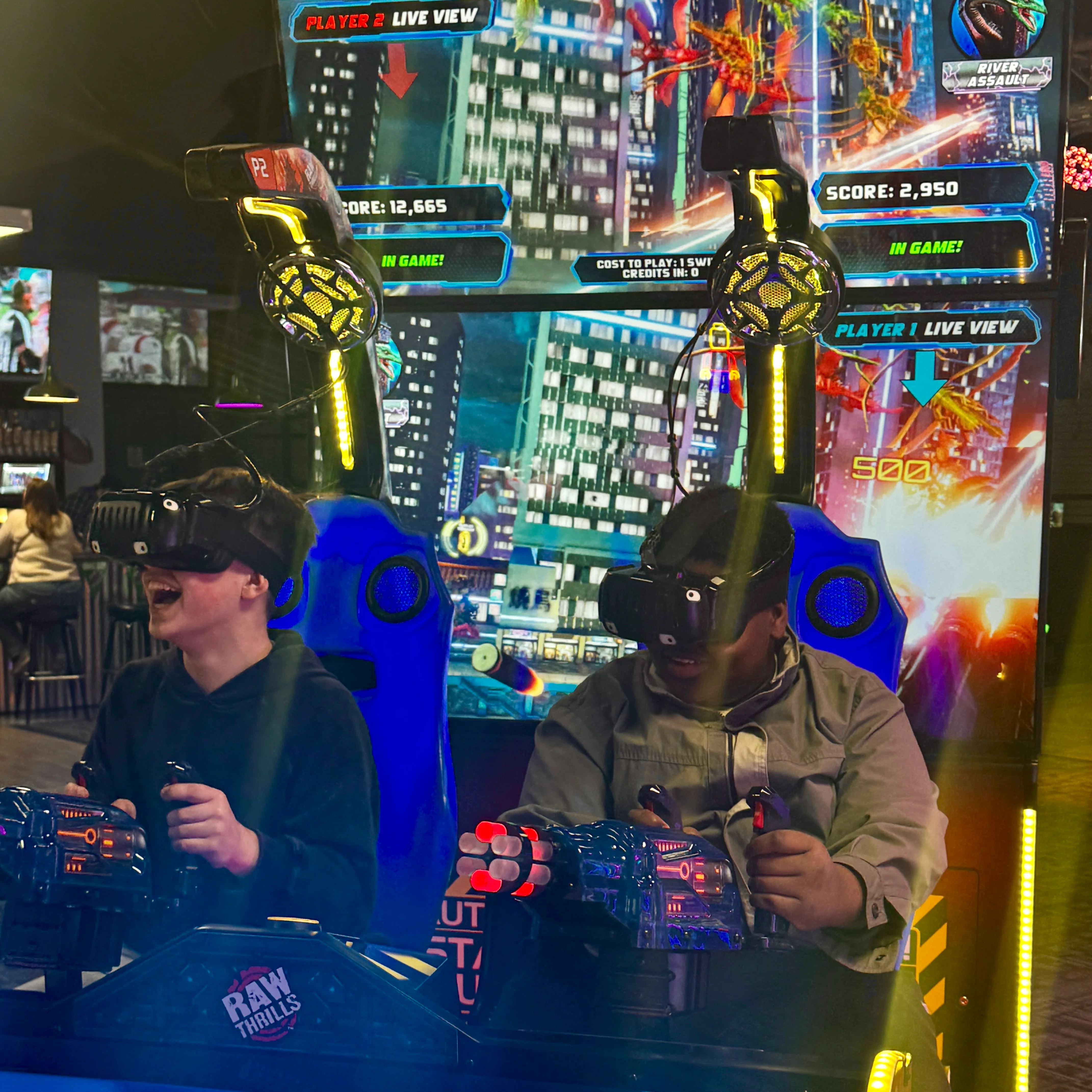 Two kids enjoying a virtual reality gaming experience
