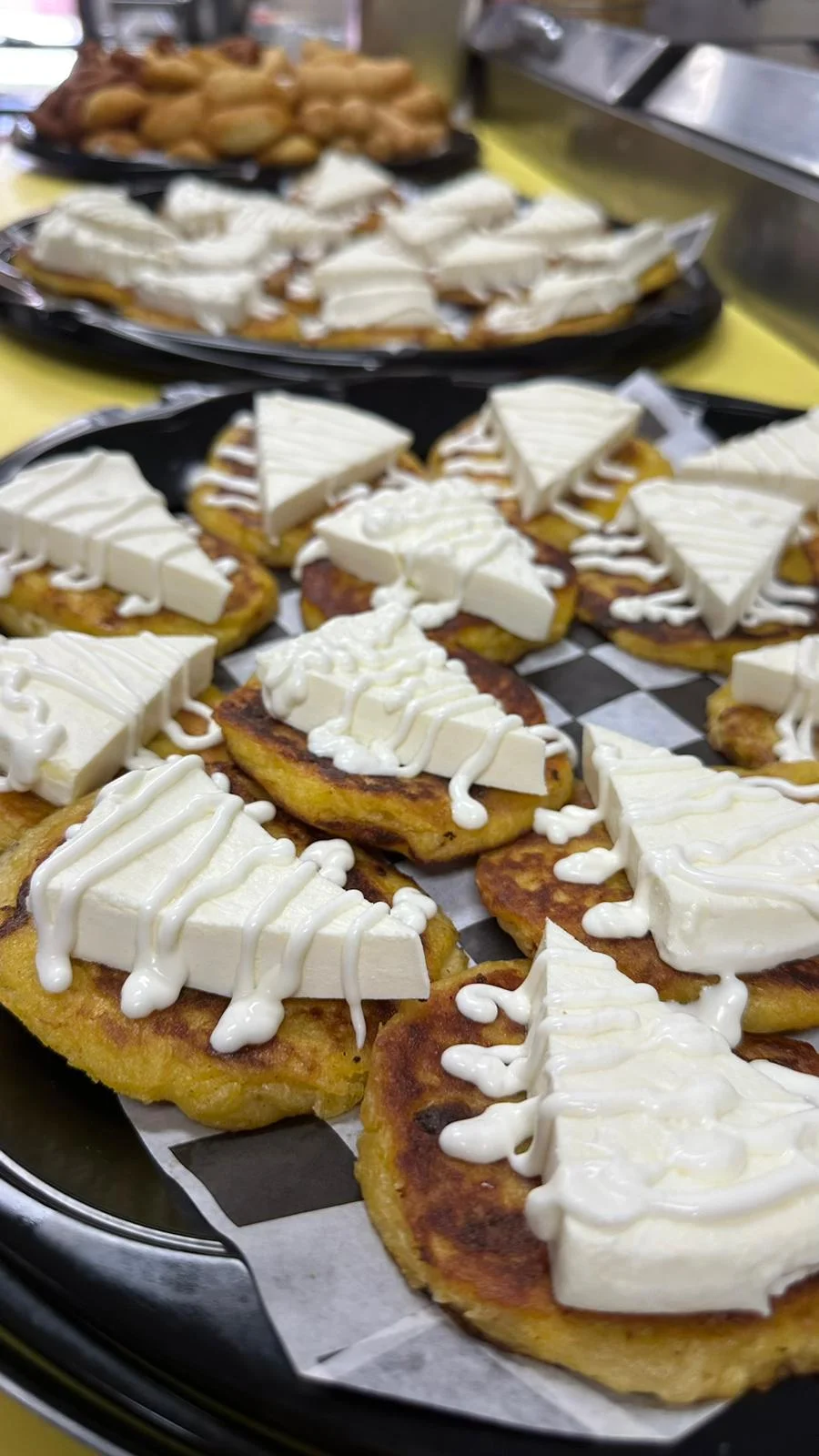 Delicious Colombian arepas with cheese and cream