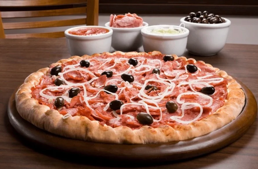 Classic Italian pepperoni pizza with olives and onions