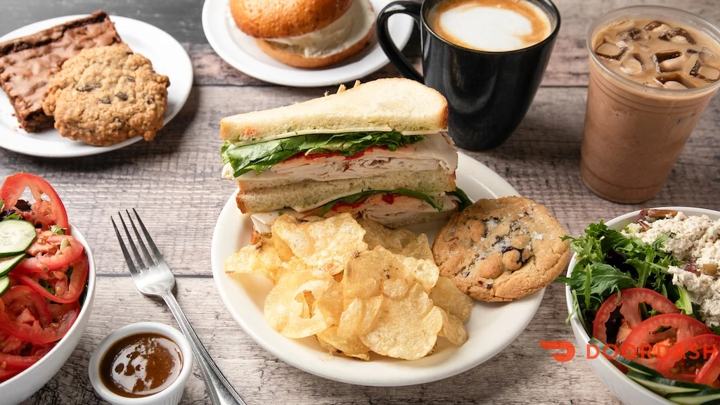 Classic deli turkey sandwich with chips and salads