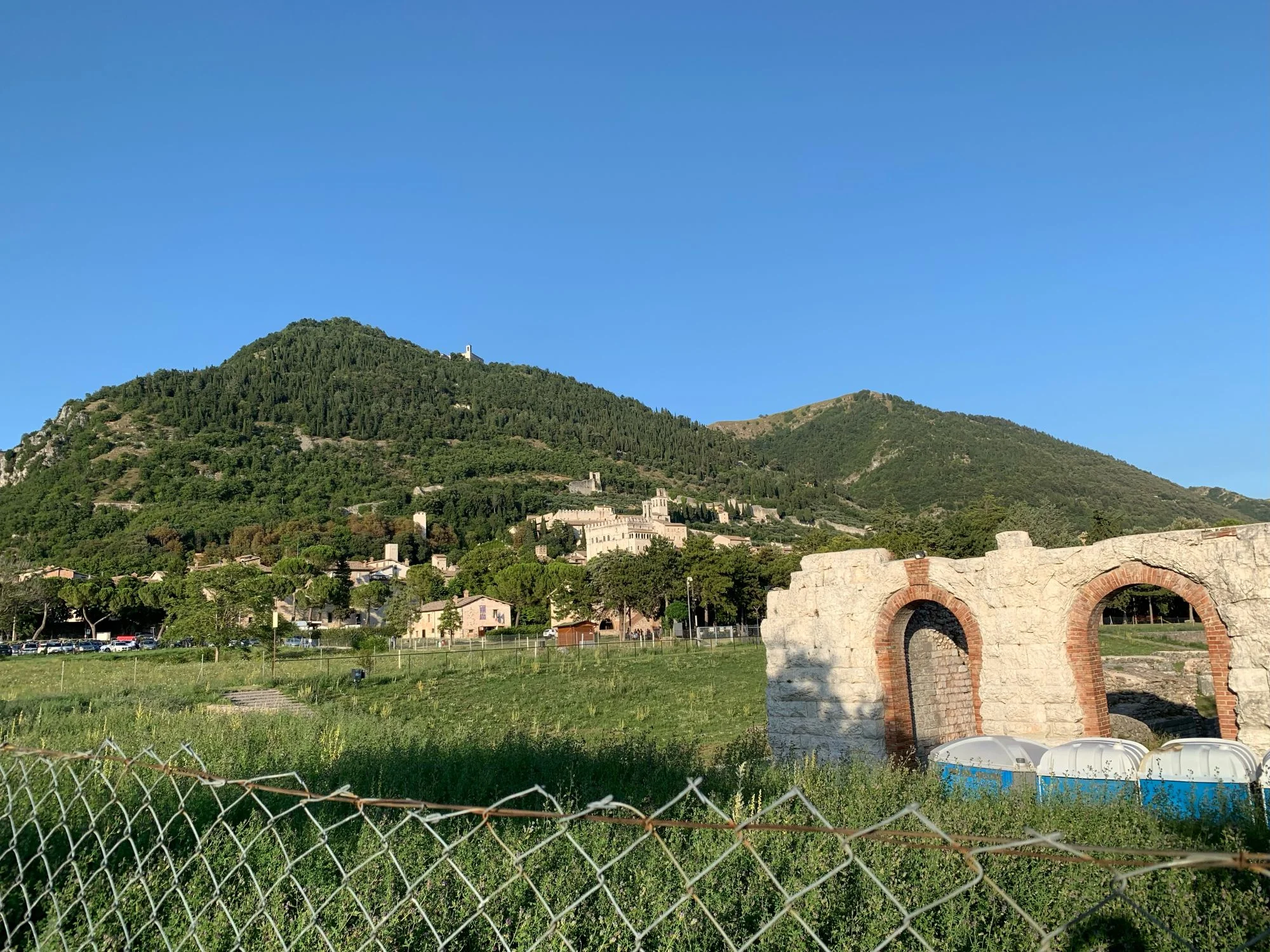 Scenic view of a mountain with historic ruins and clear blue sky