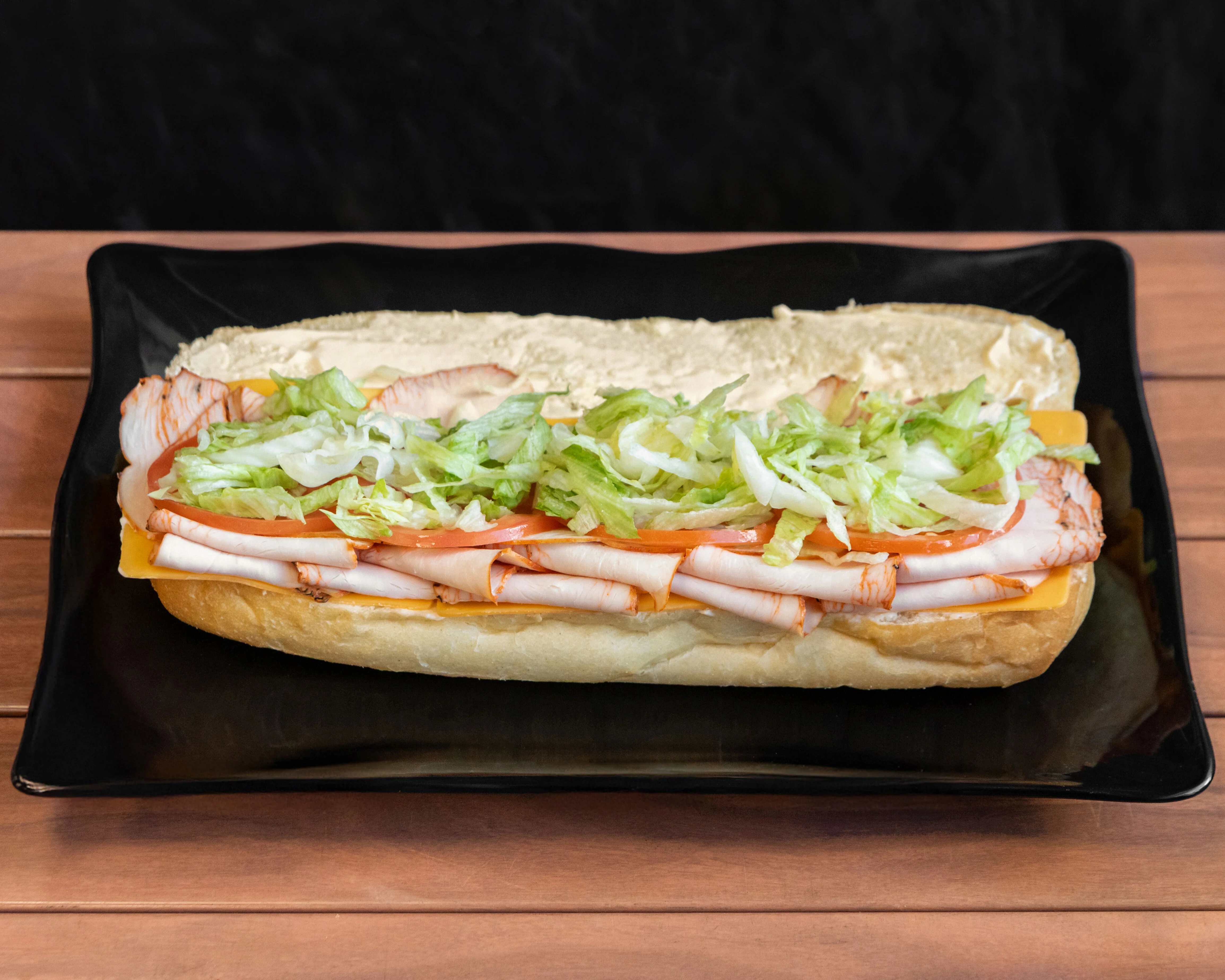 Classic deli turkey sub sandwich with lettuce and tomato