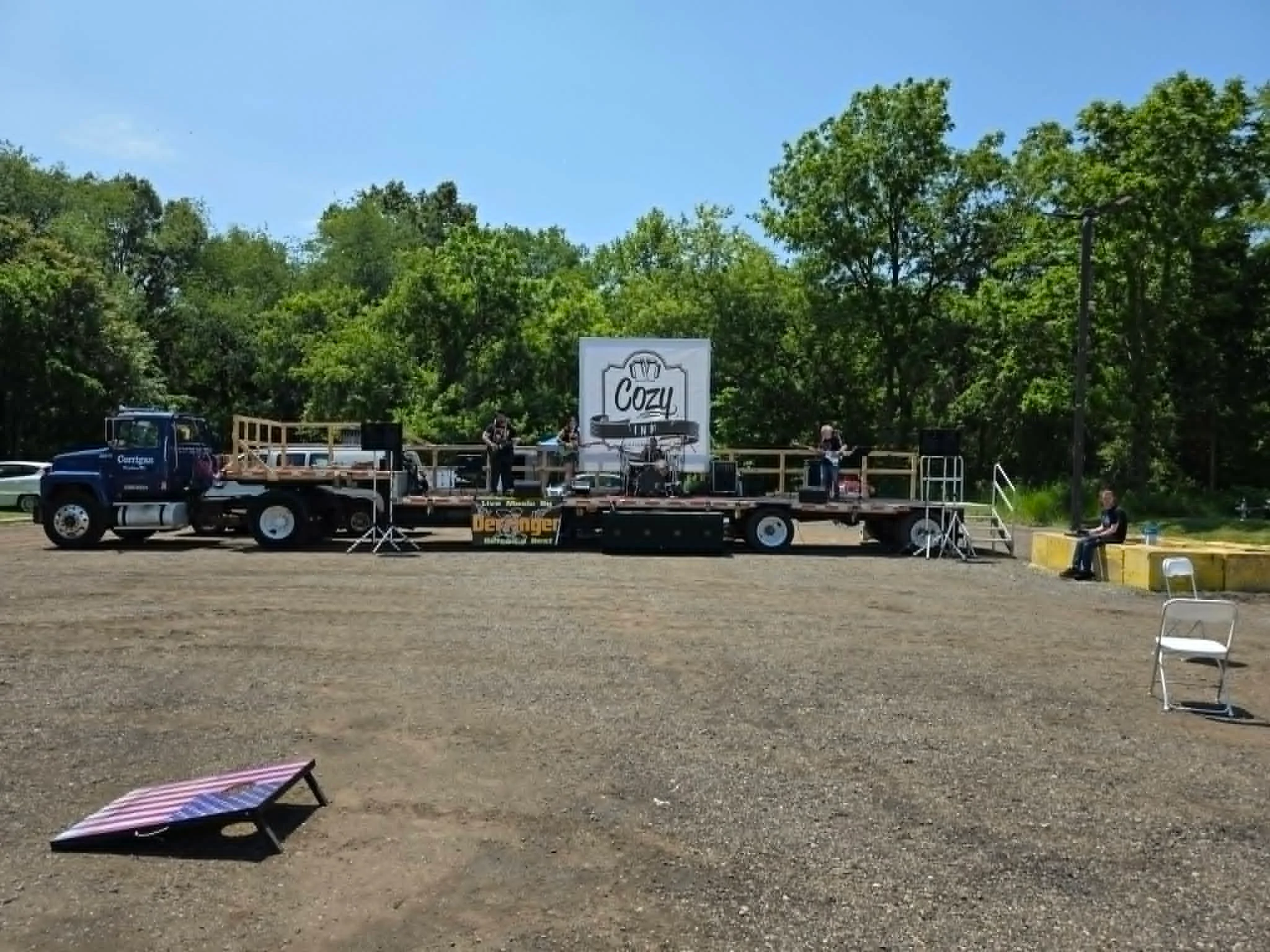 Live music performance on a truck stage at an outdoor event