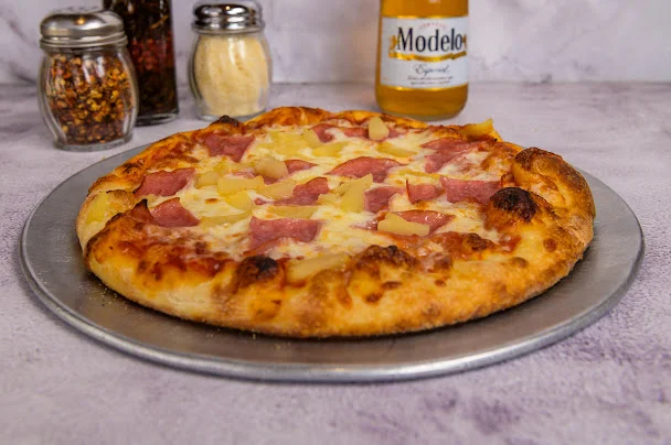 Hawaiian pizza with ham and pineapple