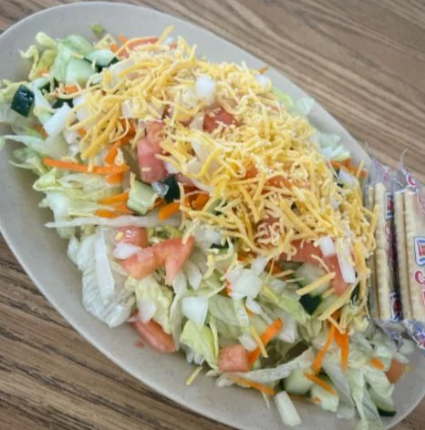 Fresh garden salad with shredded cheese