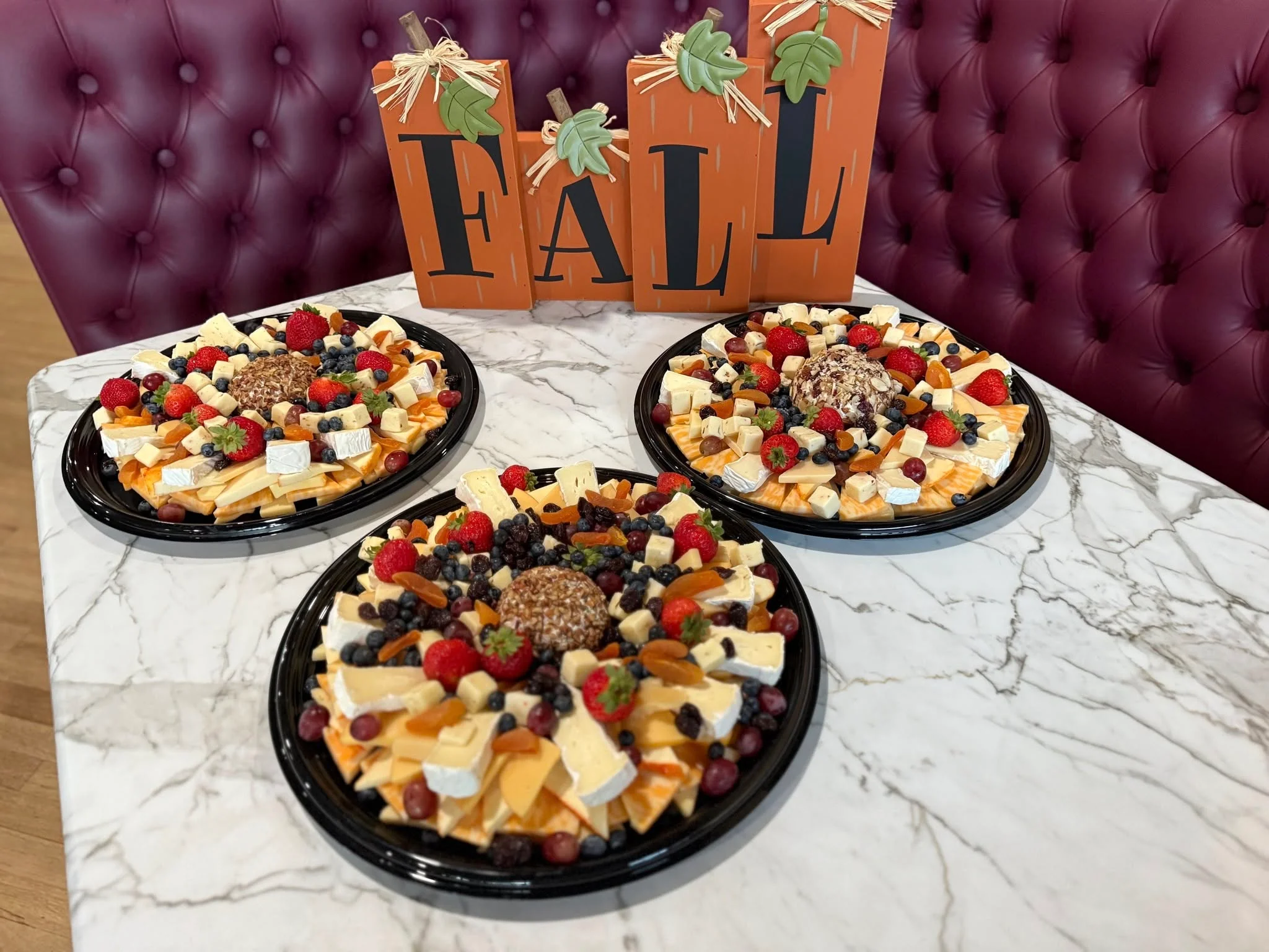 Artisan cheese platter with seasonal fruits