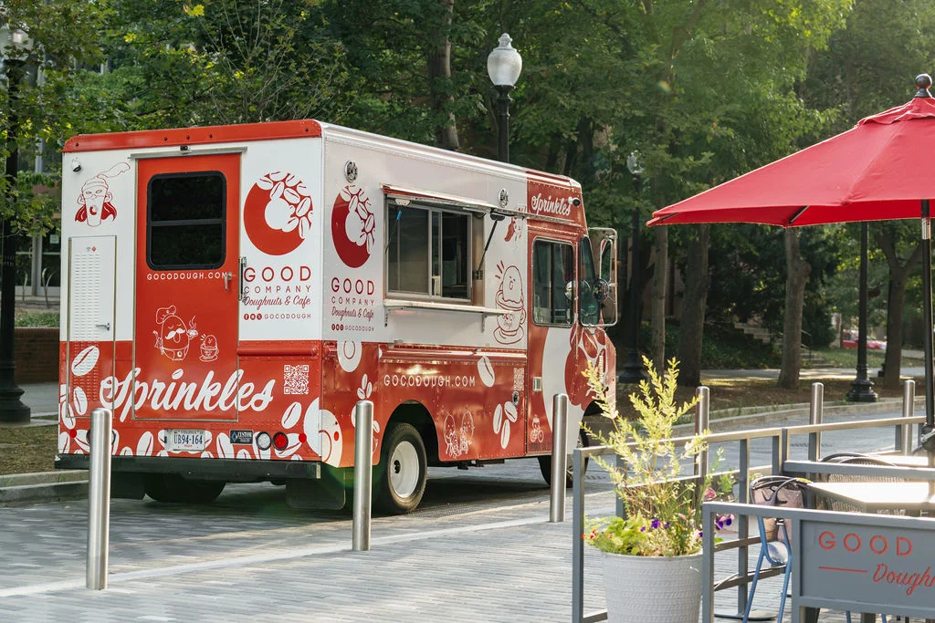 Colorful food truck serving gourmet doughnuts