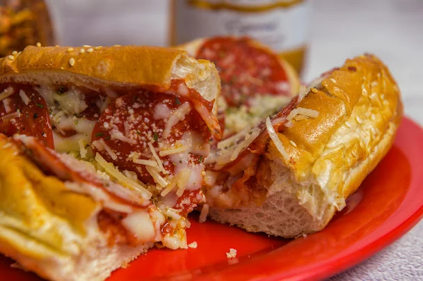 Italian meatball sub sandwich on a red plate