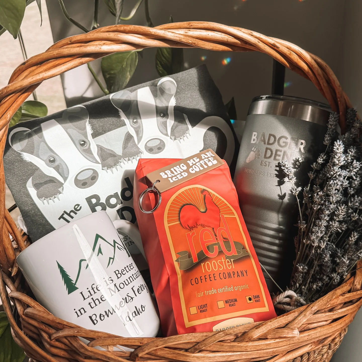 Gift basket with coffee, mugs, and cozy items