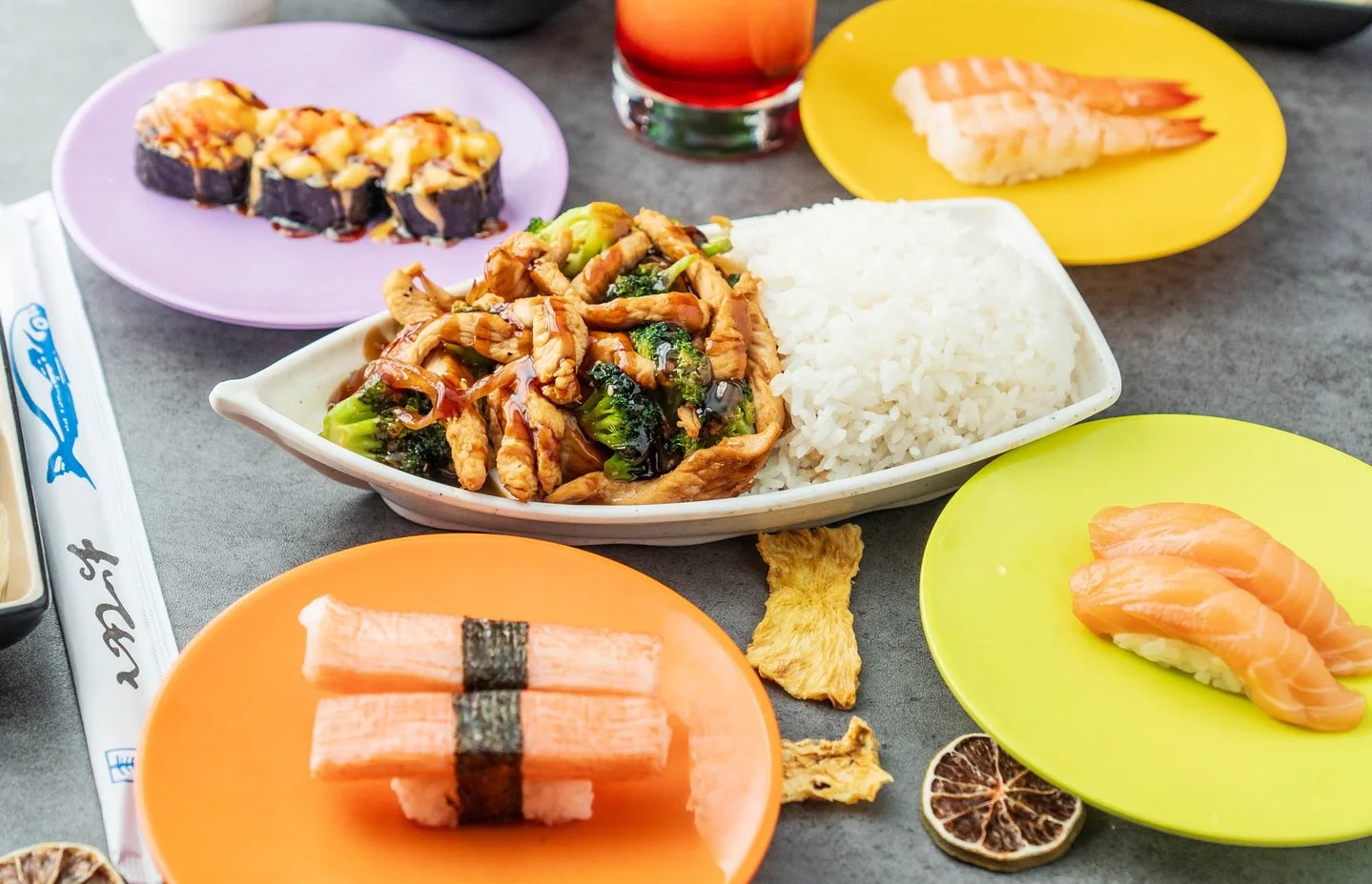 Japanese sushi platter with chicken stir-fry and rice