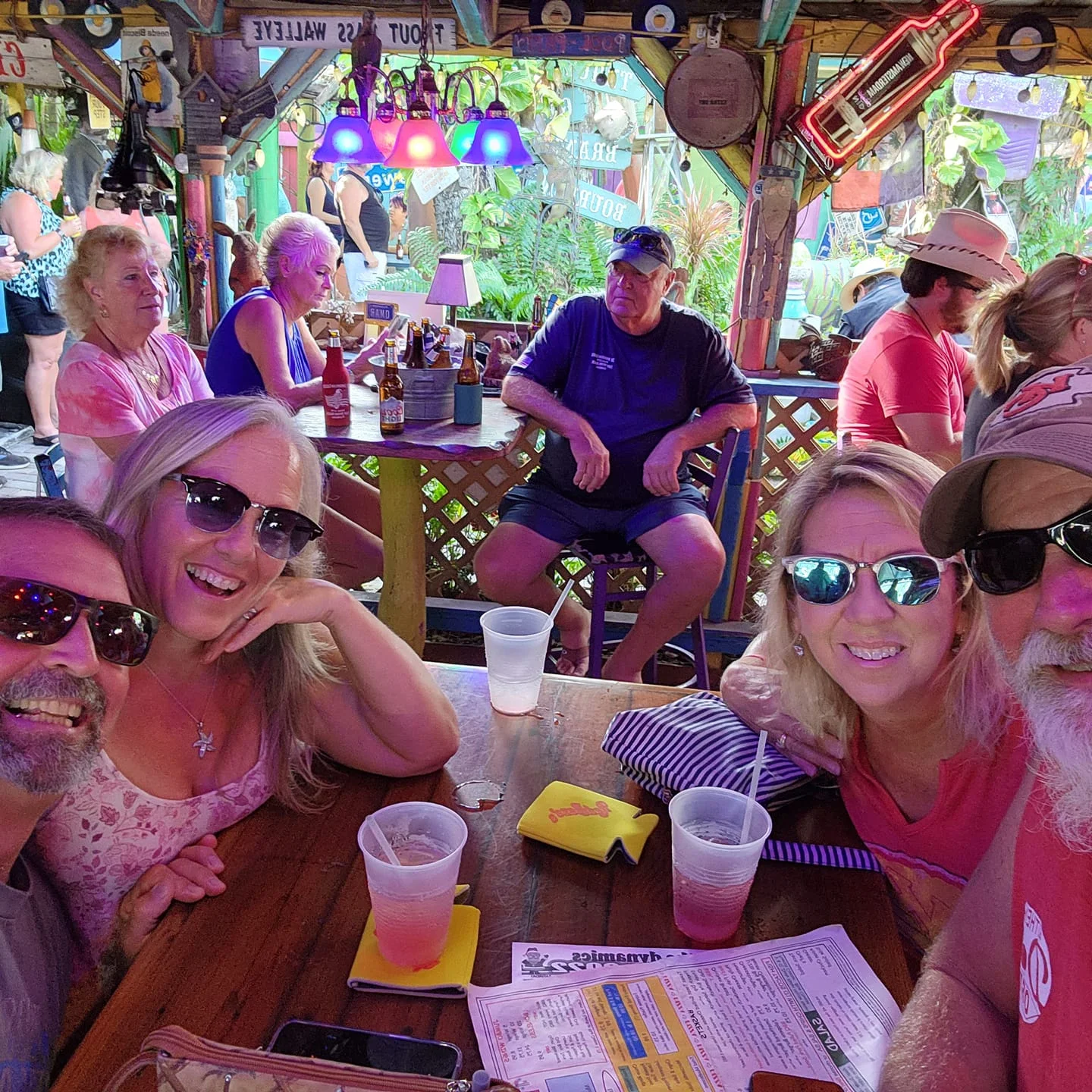 Vibrant restaurant scene with patrons enjoying drinks and lively decor