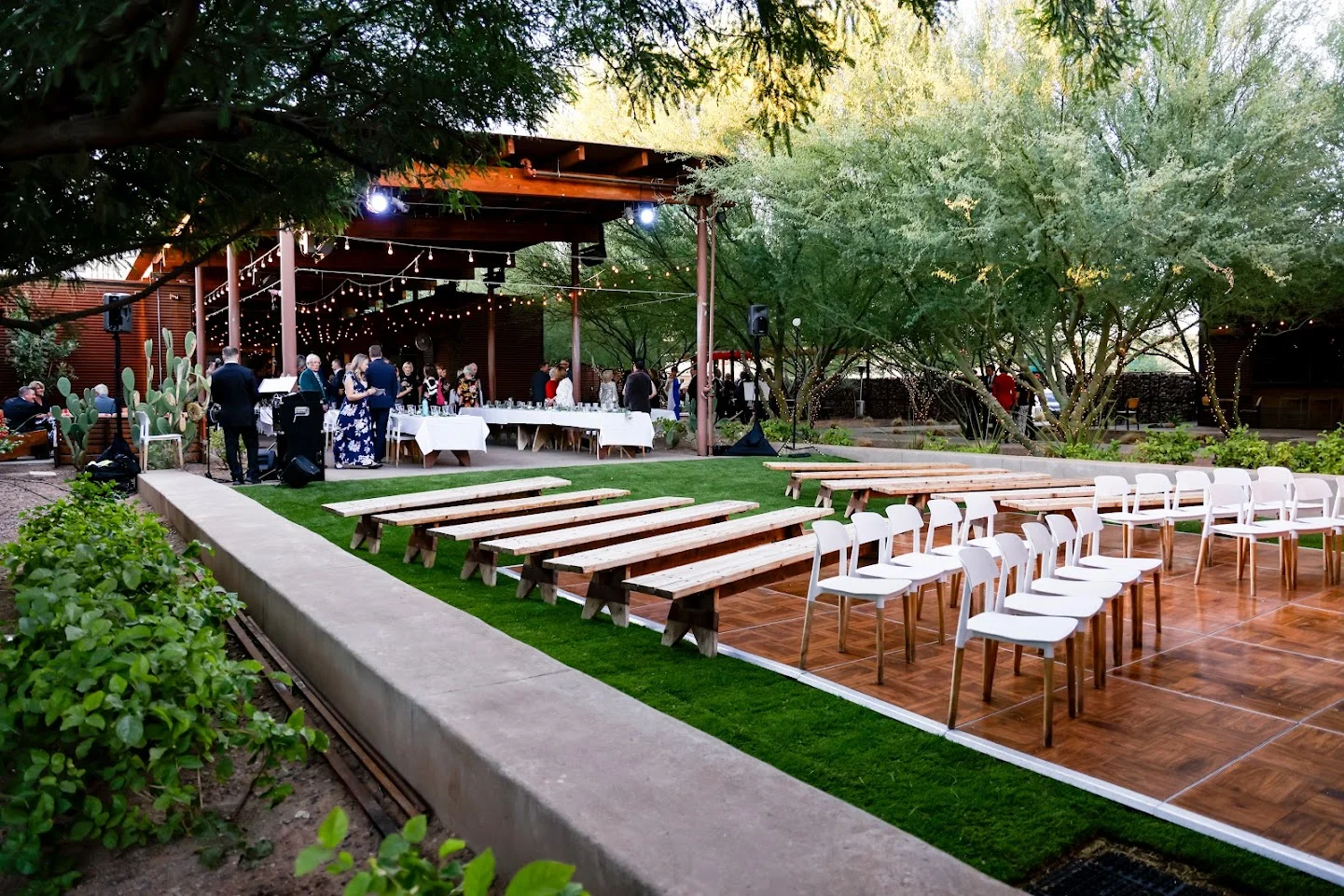 Outdoor event space with seating and string lights