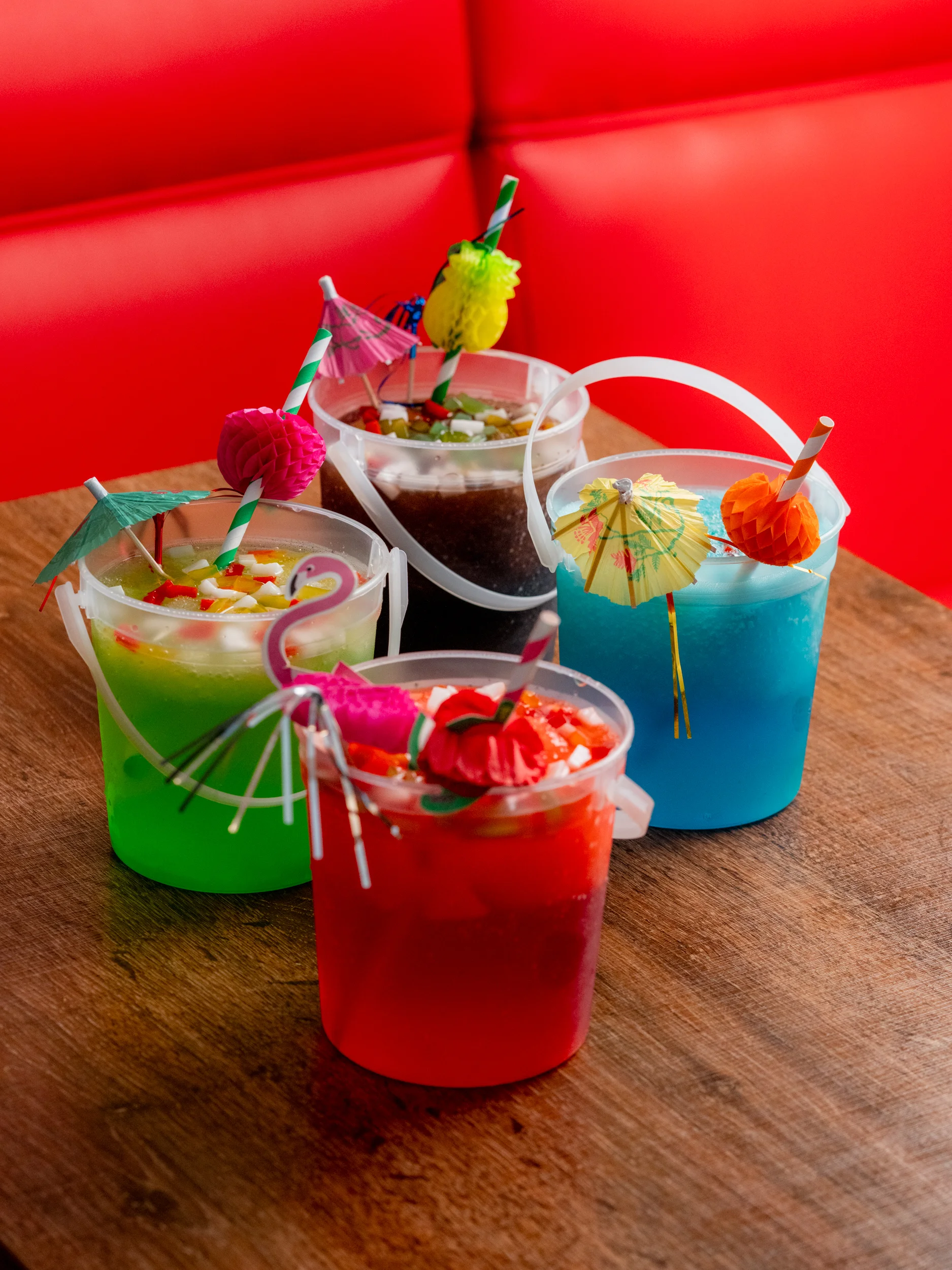 Colorful tropical cocktails in festive buckets