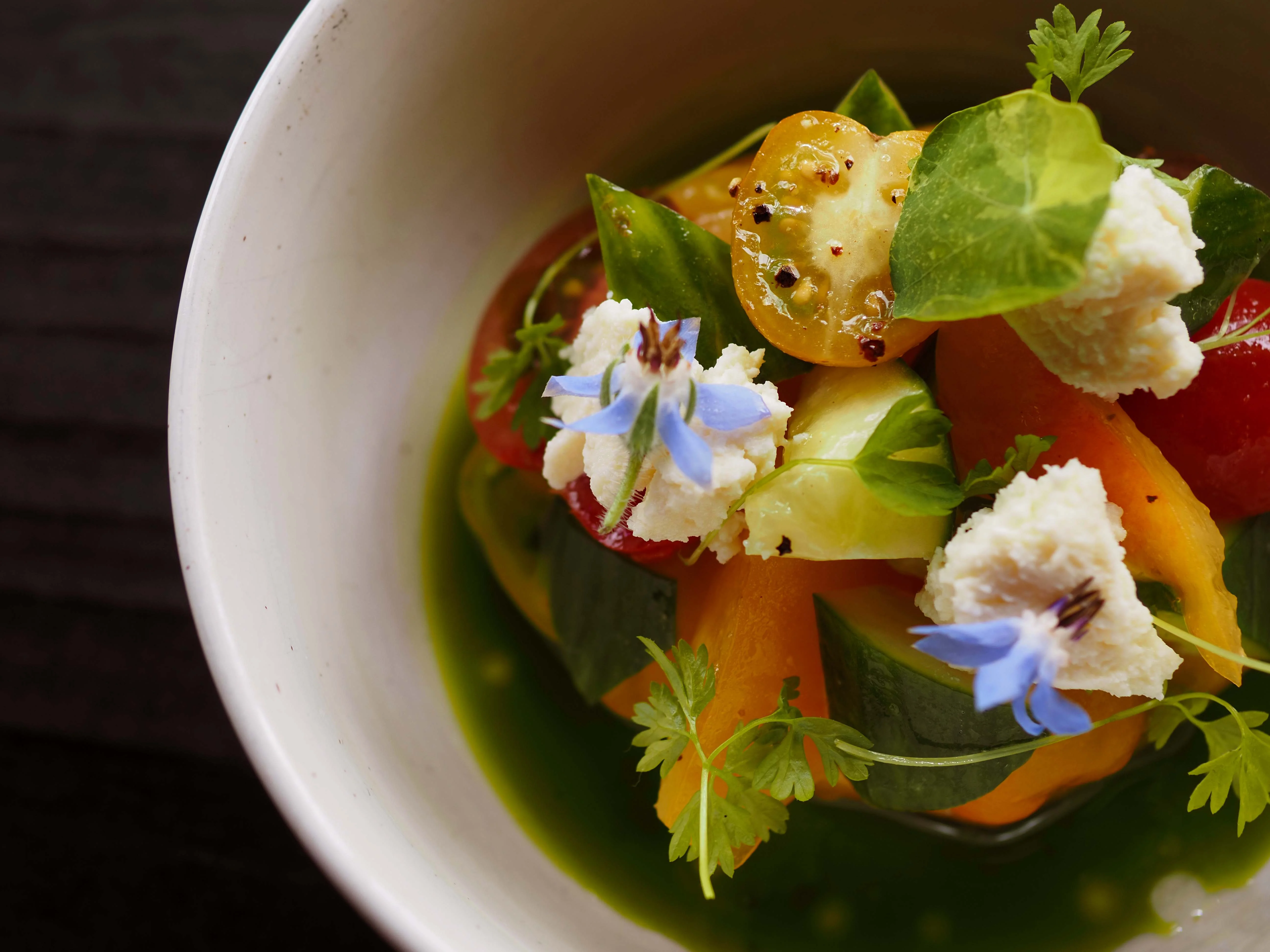 Colorful summer salad with edible flowers