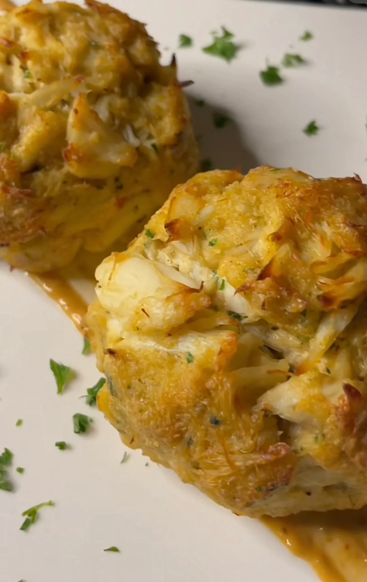 Delicious crab cakes served with a tangy sauce