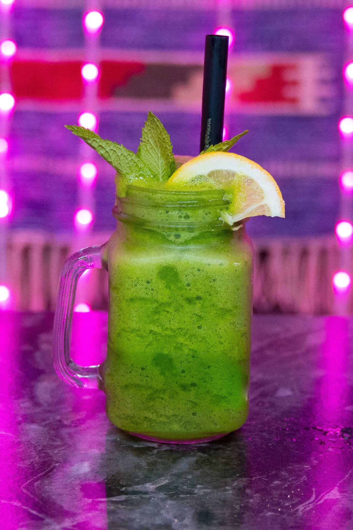 Refreshing mint lemonade in a mason jar with lemon slices