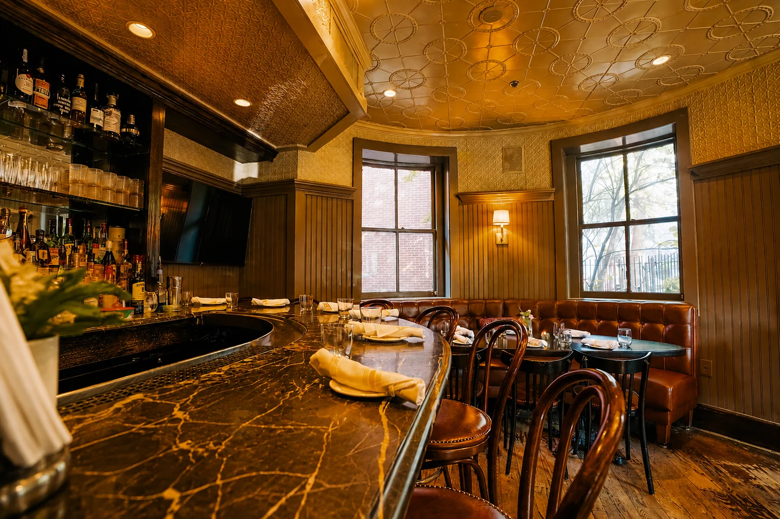 Elegant restaurant bar and dining room with vintage decor