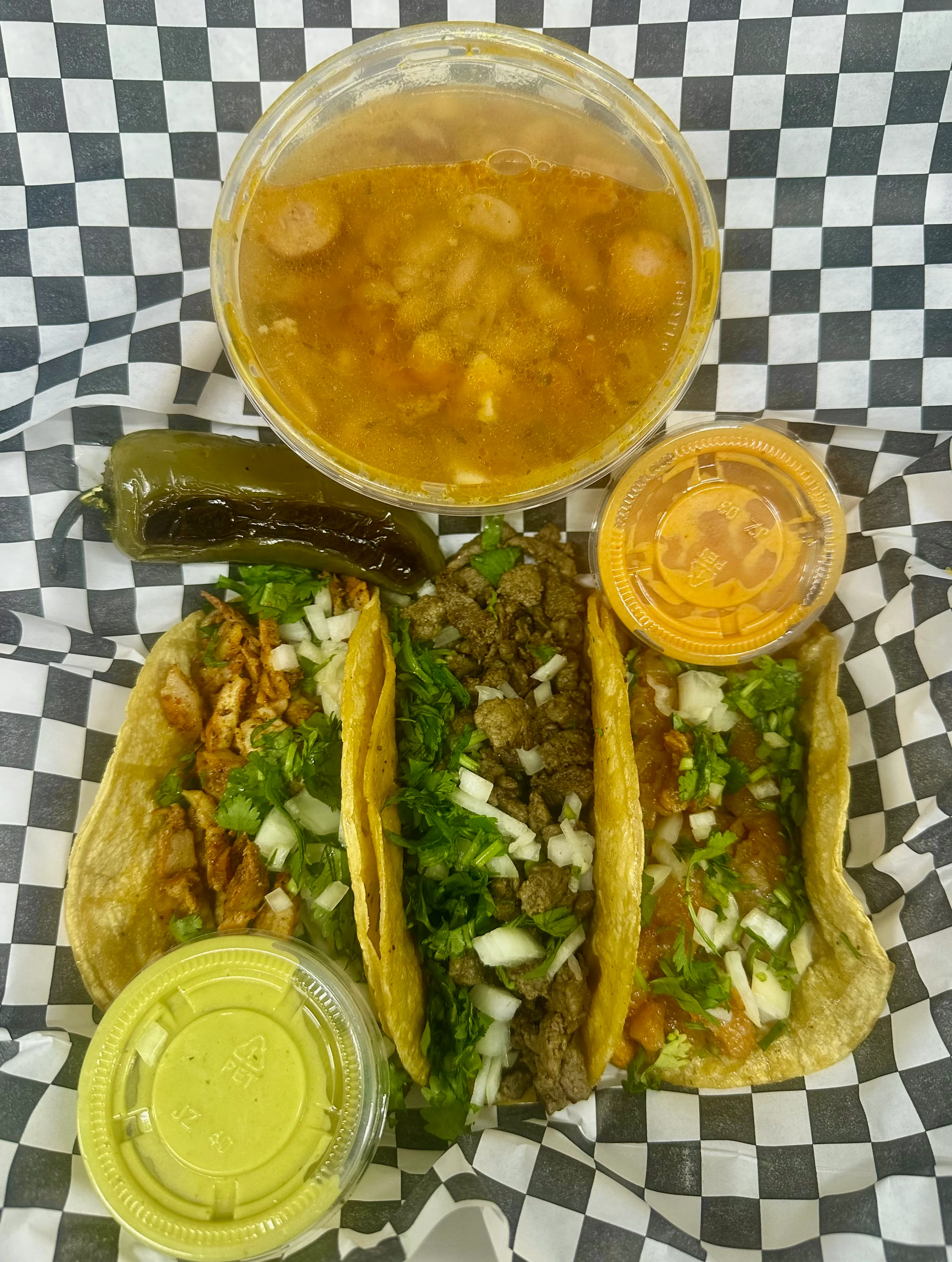 Authentic Mexican street tacos with consommé