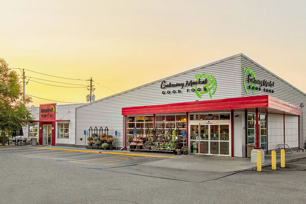 Gateway Market exterior at sunset with vibrant signage