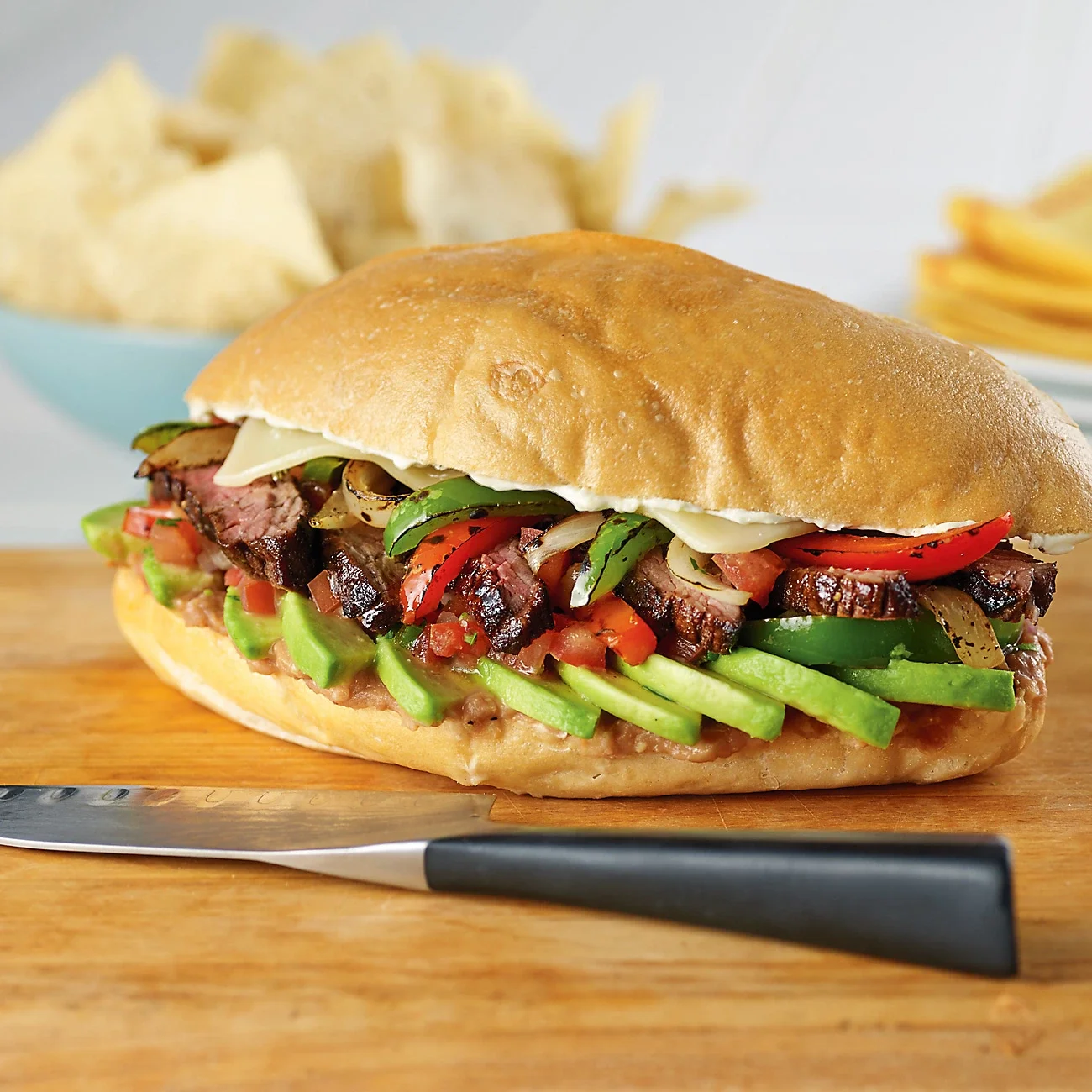 Delicious Mexican torta with grilled steak and fresh vegetables