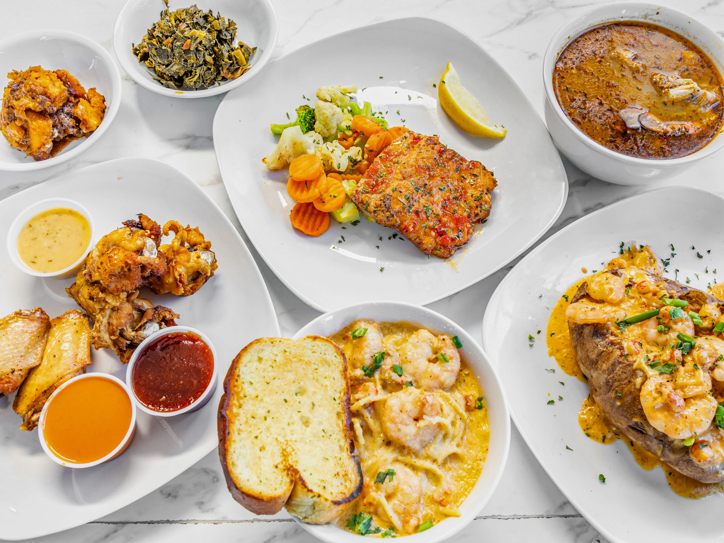 Southern-style shrimp and grits with sides and cornbread