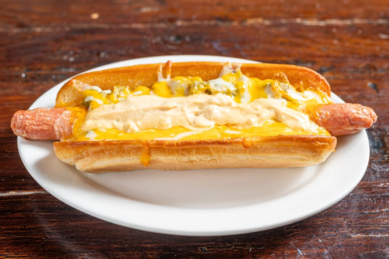 Loaded chili cheese dog on a plate