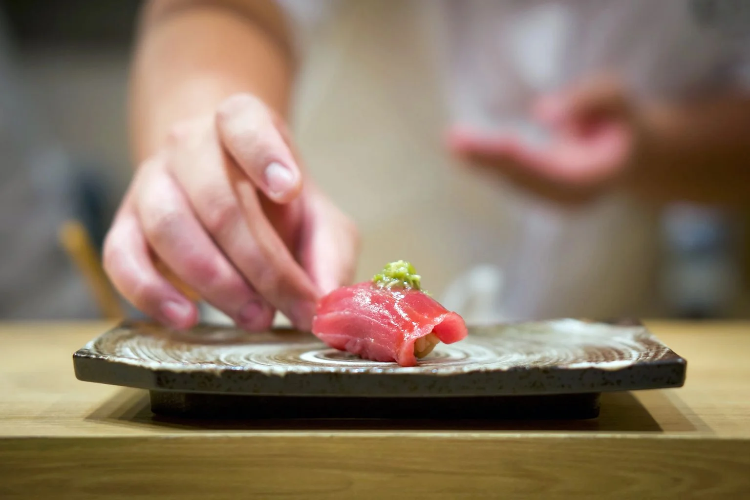 Japanese sushi with fresh tuna and wasabi on a decorative plate