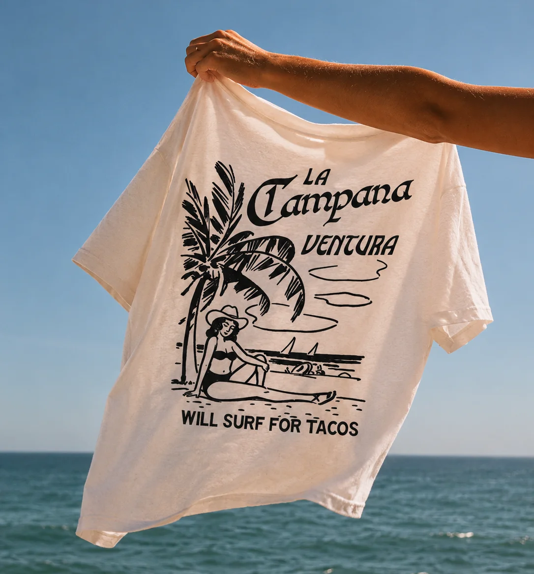 Vintage surf t-shirt with taco slogan by the beach
