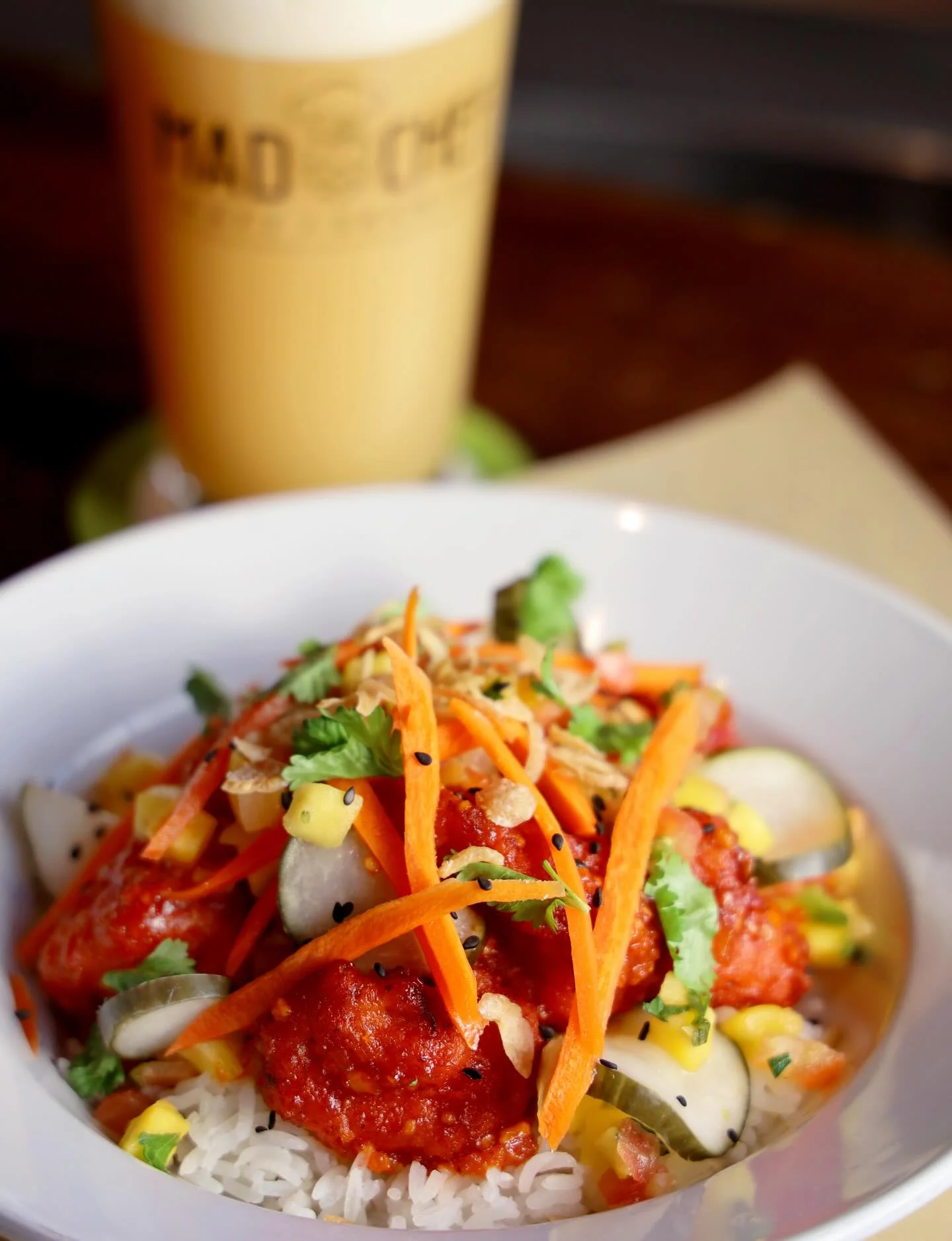 Spicy Korean fried chicken rice bowl with fresh vegetables