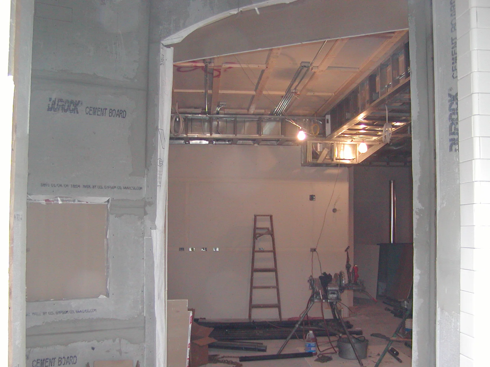Construction site interior with exposed walls and lighting fixtures
