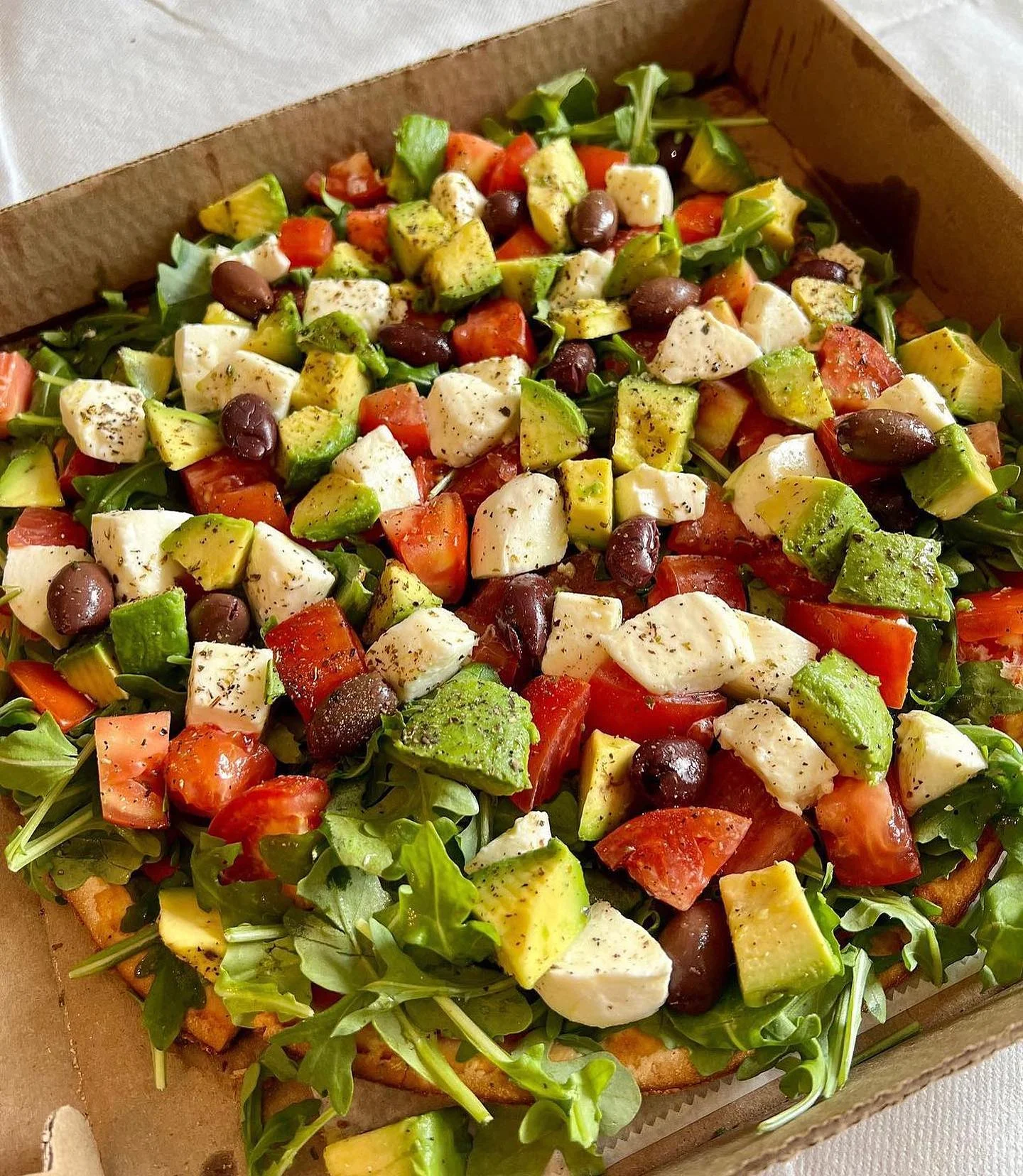 Fresh Mediterranean salad with mozzarella and arugula