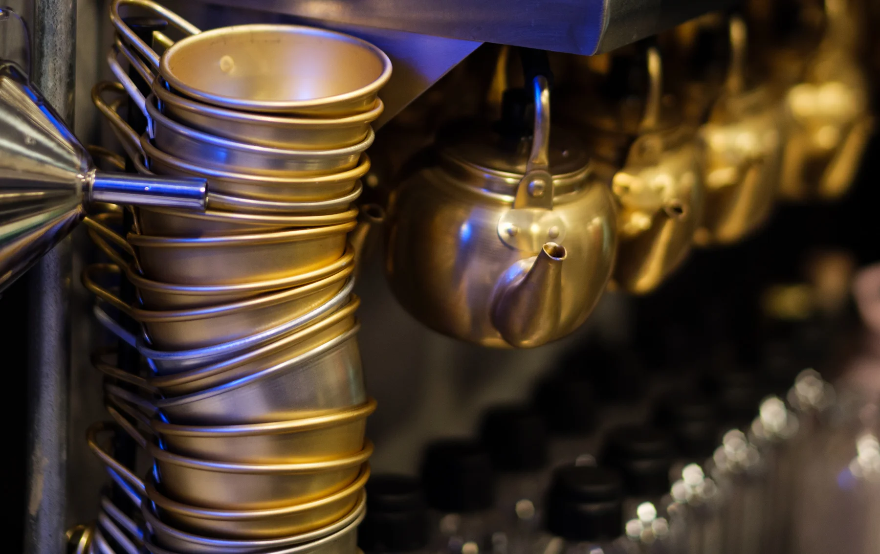 Stylish bar setup with golden cups and glassware