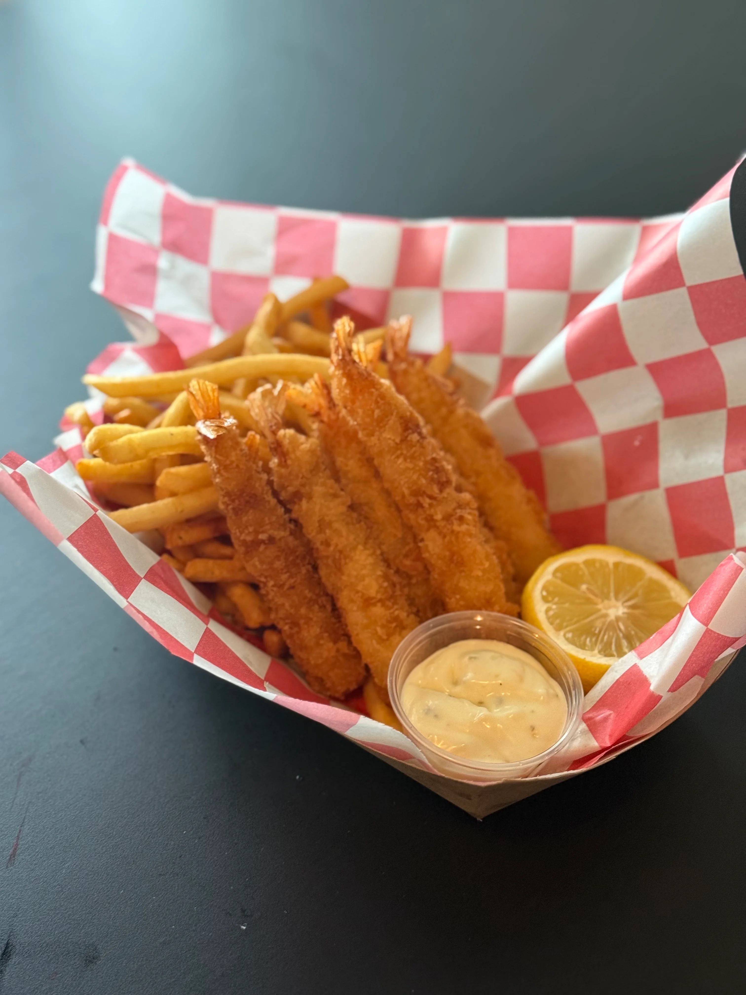 Crispy shrimp basket with fries and dipping sauce