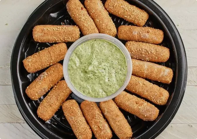 Crispy Indian vegetable pakoras with green chutney