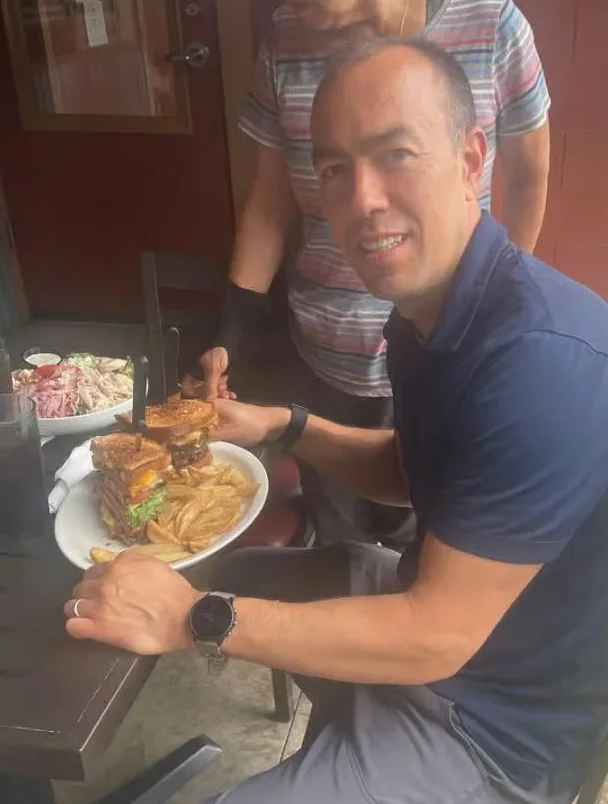 Delicious burger with fries at a casual outdoor dining setting