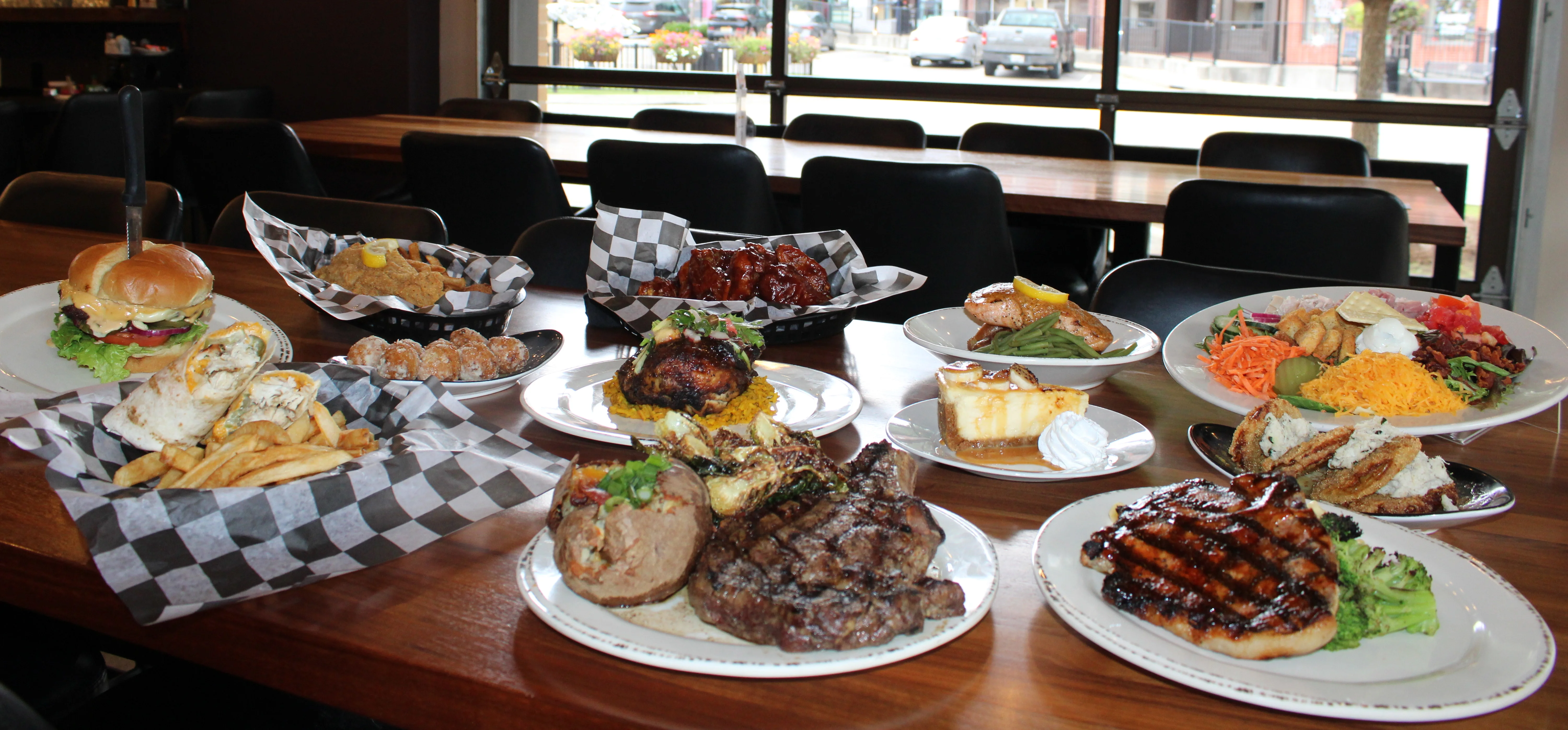 Variety of American comfort food dishes on a wooden table