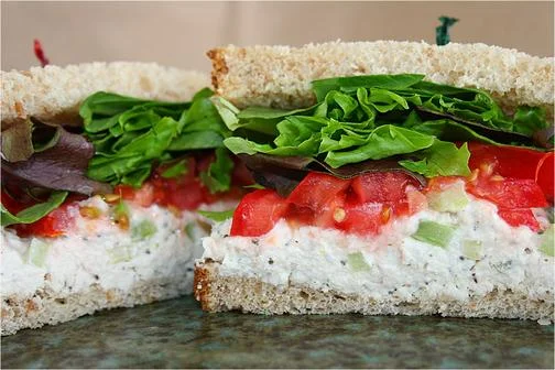 Freshly made chicken salad sandwich with greens