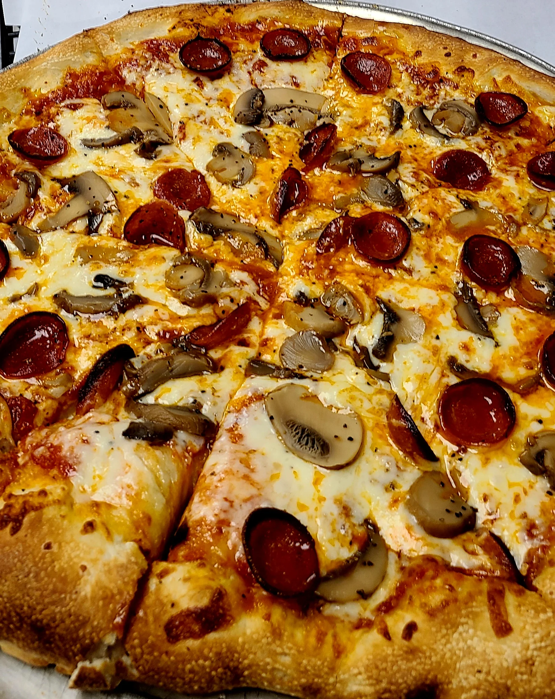 Pepperoni and mushroom pizza, a classic Italian-American favorite