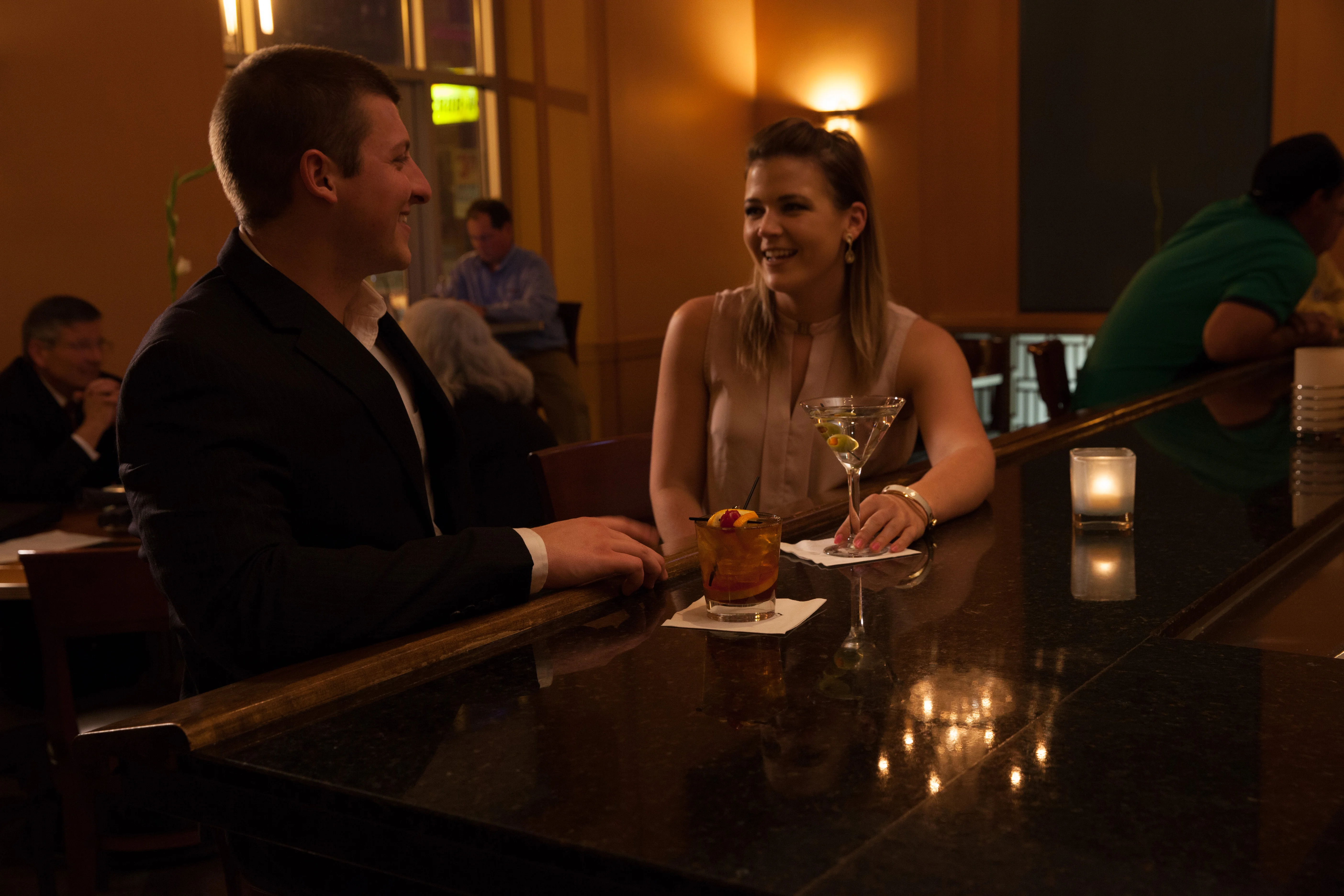 A vibrant restaurant bar with a variety of drinks and appetizers.