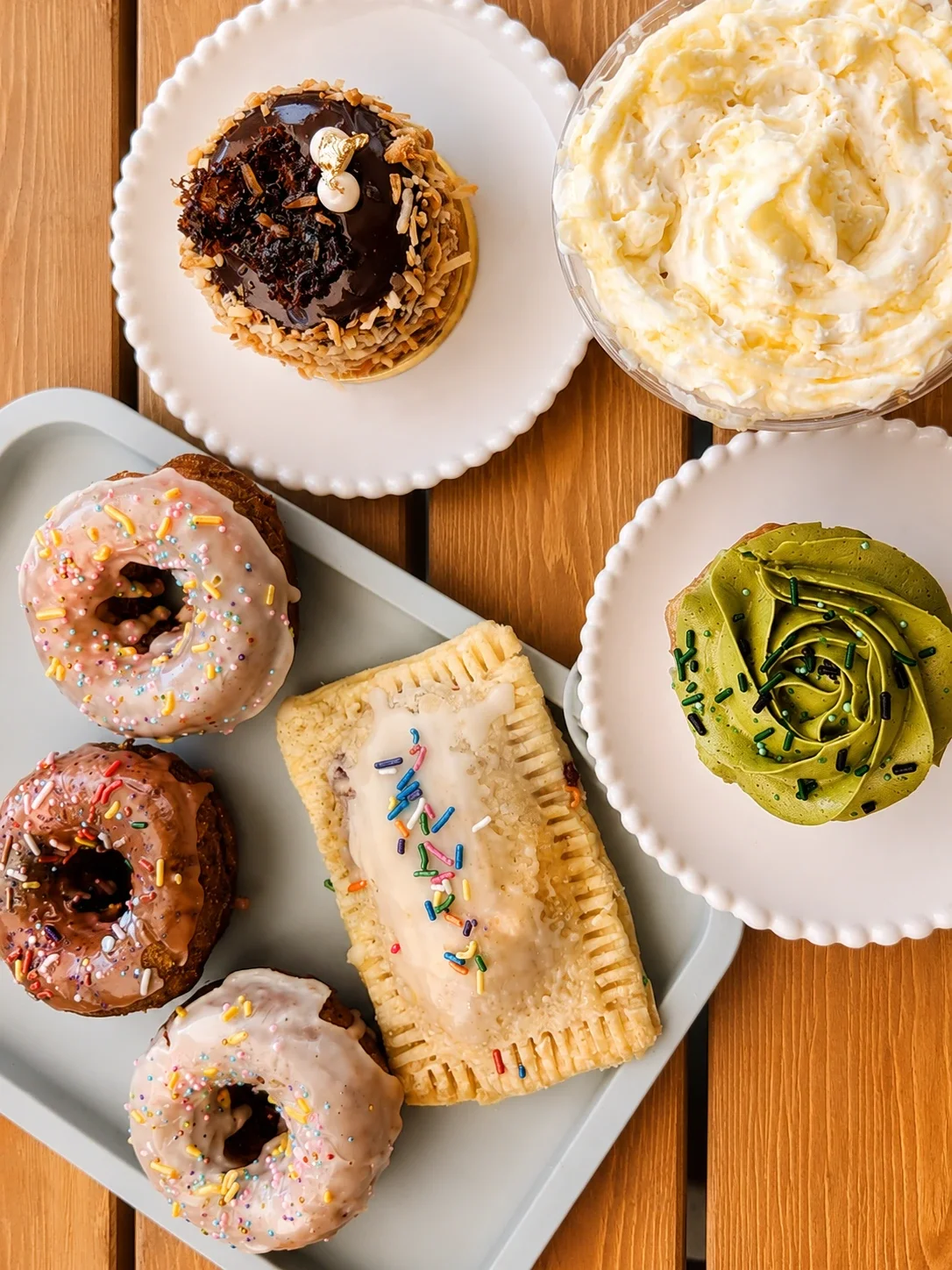 Assorted gourmet donuts and pastries on a tray
