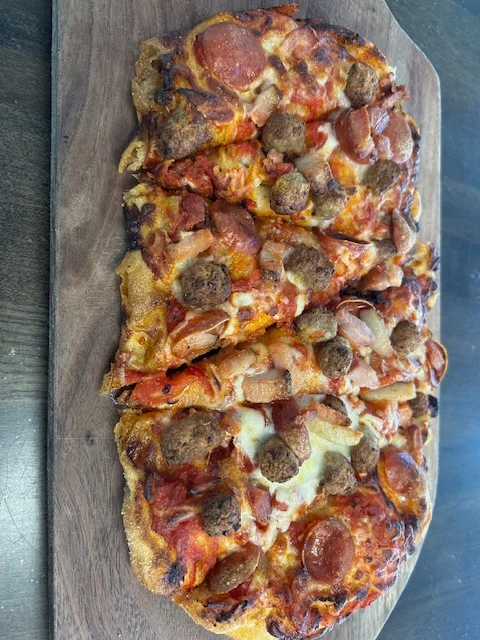 Loaded meat lover's pizza with pepperoni and sausage