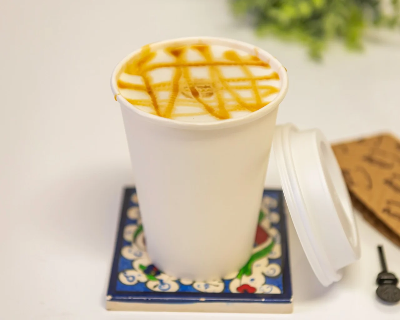 Caramel macchiato in a takeout cup