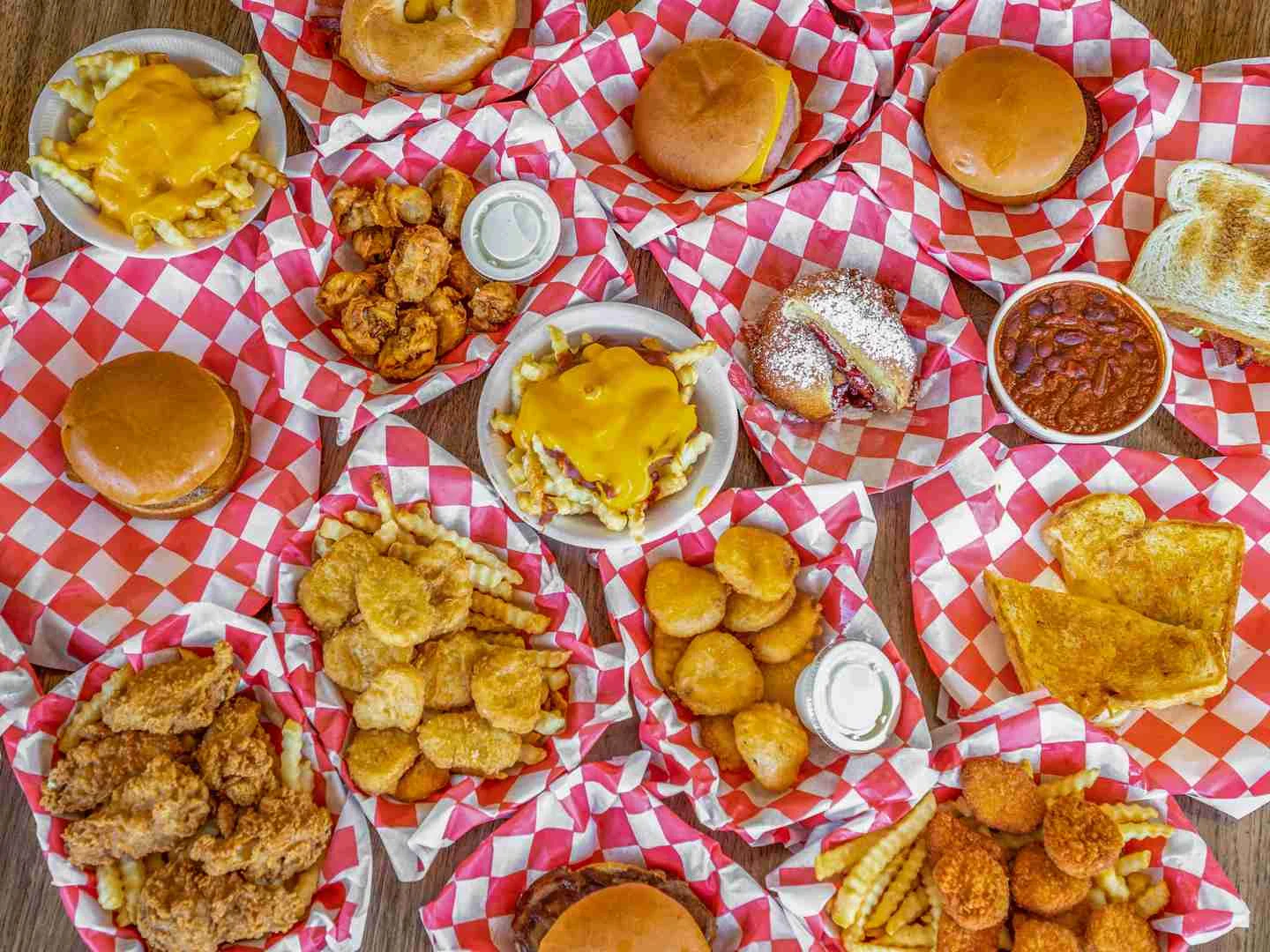 Southern fried chicken platter with sides and burgers